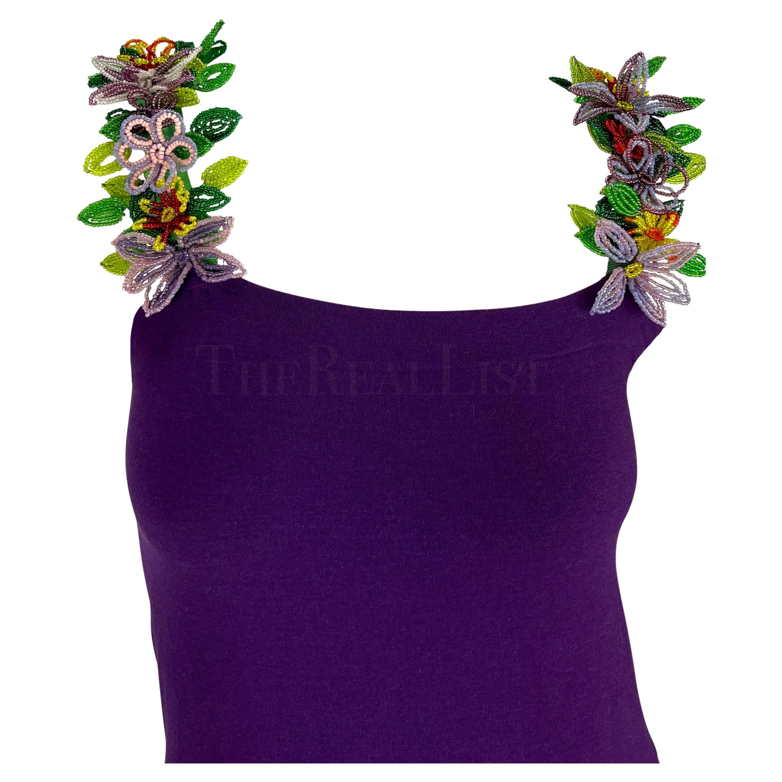 Presenting an incredible deep purple Dolce & Gabbana floral beaded body con dress. From the  Spring/Summer 1992 collection, this body con tube dress is accented with multicolored floral beaded straps. The structured beaded flowers add the perfect 3D