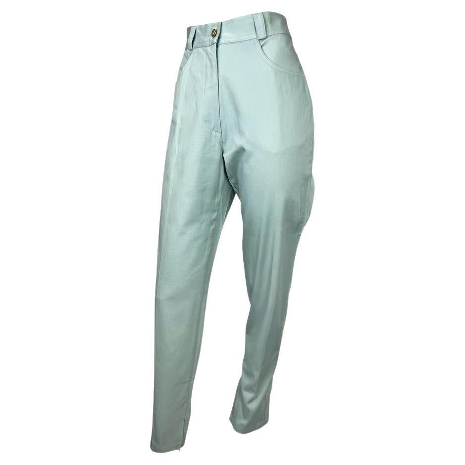 Presenting a baby blue pair of Gianni Versace Couture pants, designed by Gianni Versace. From the Spring/Summer 1992 collection, these pants are brand new with the brand an department store tags still attached. High waisted with zippers at the