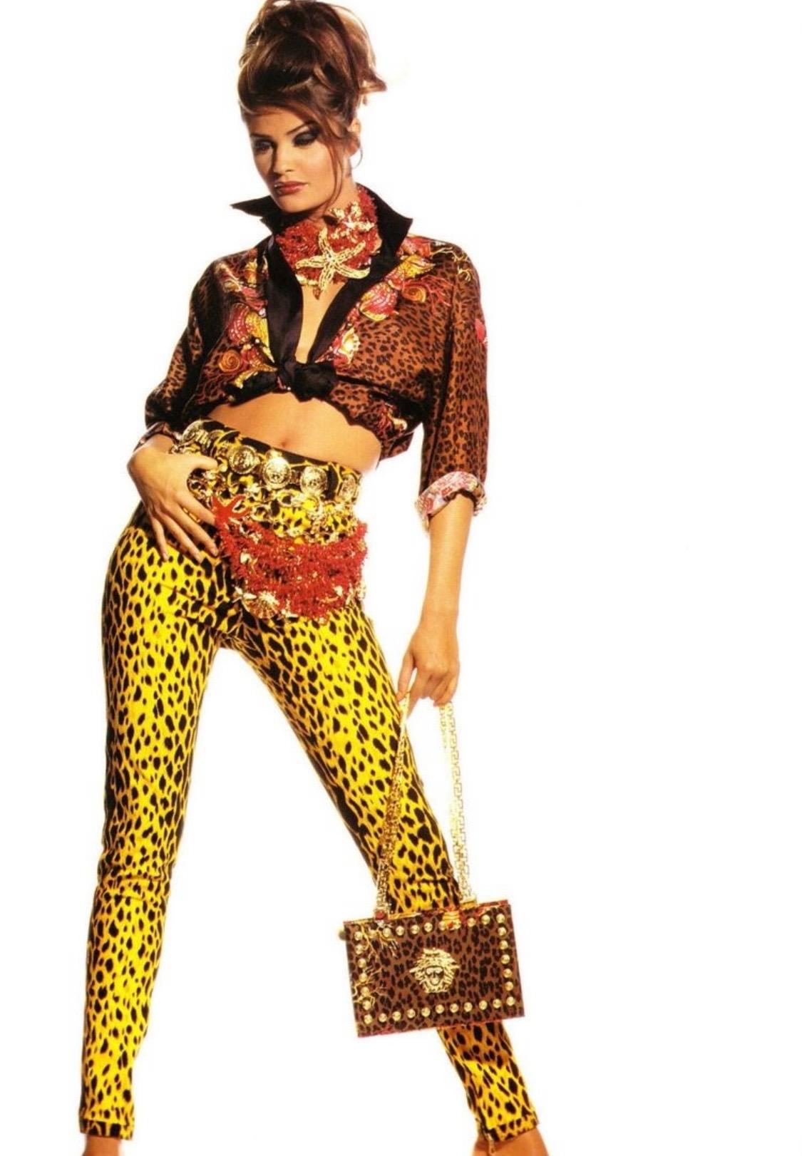 Presenting a leopard print Medusa medallion accented shoulder bag designed by Gianni Versace. This print debut on the Spring/Summer 1992 runway and features a gold-toned metal zipper closure. In describing this collection Gianni said: 