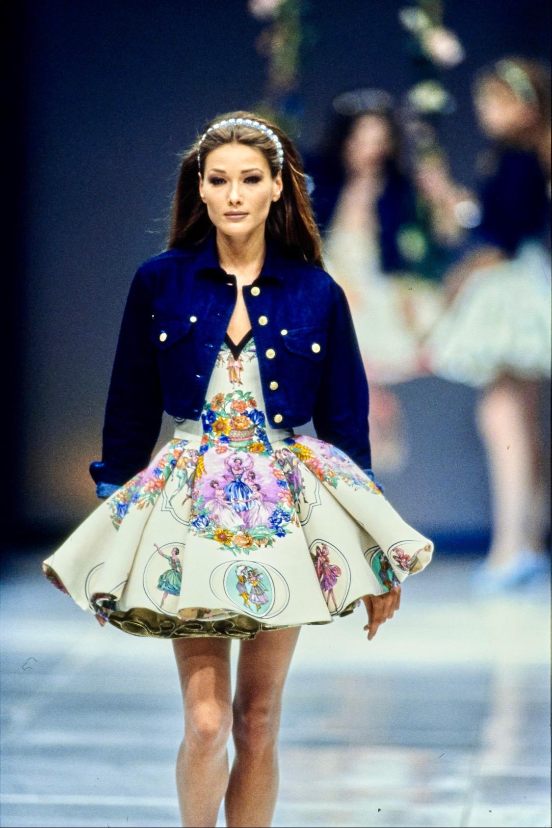 Presenting a blue cotton-blend denim jacket designed by Gianni Versace for his Spring/Summer 1992 collection. Similar jackets were worn on the season's runway over delicate flare dresses on look 1 on Milla Jovovich, look 2 on Carla Bruni, and look 3