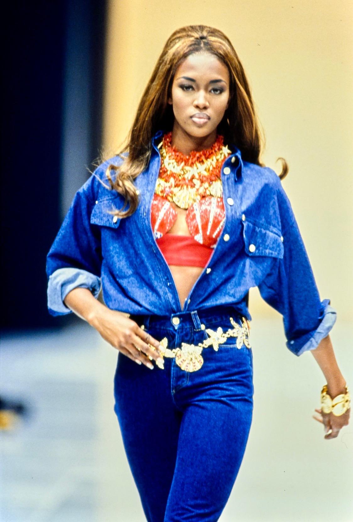 Presenting a blue cotton denim button-down designed by Gianni Versace for his Spring/Summer 1992 collection. Similar jackets denim tops debuted on the runway on Marpessa Hennink, Yasmeen Ghauri, and Naomi Campbell. The shirts were also worn over