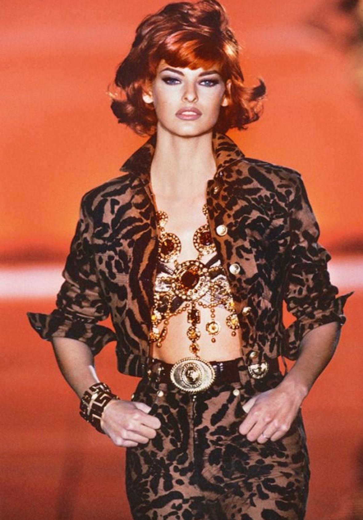 Presenting a fabulous brown Gianni Versace cropped jacket, designed by Gianni Versace. From the Spring/Summer 1992 collection, this jacket debuted on the season's runway as part of look 19, modeled by Linda Evangelista. Covered in a distinctive