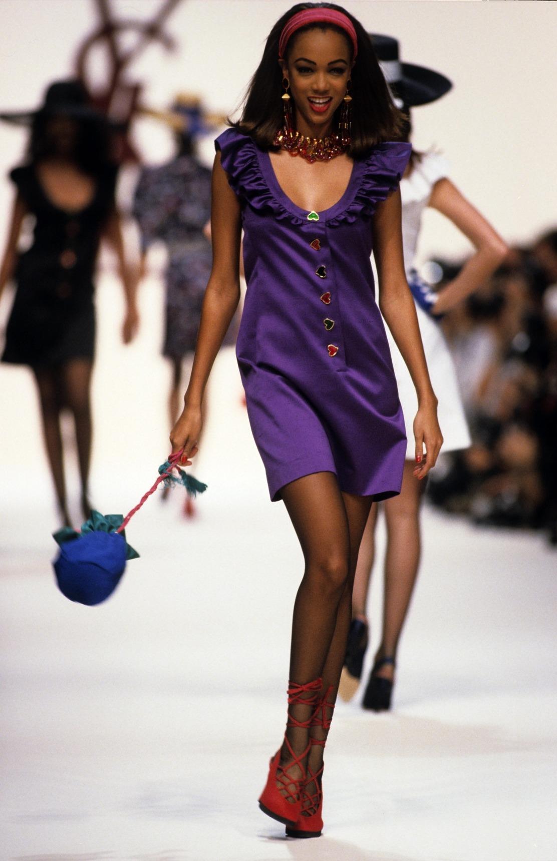 Presenting a fabulous bright green Yves Saint Laurent mini dress, designed by Yves Saint Laurent. From the Spring/Summer 1992 collection, this dress debuted on the season’s runway in purple, on Tyra Banks, and in black. Karen Mulder wore the black