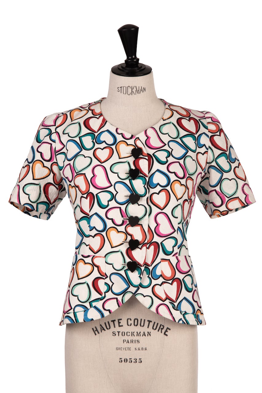 Lovely Yves Saint Laurent heart-print spencer jacket or top with heart-shaped buttons dated from Spring/Summer 1992. The design is from the 'Variation' line which was a second ready-to-wear line – after 'Rive Gauche' – that was created in 1982 and