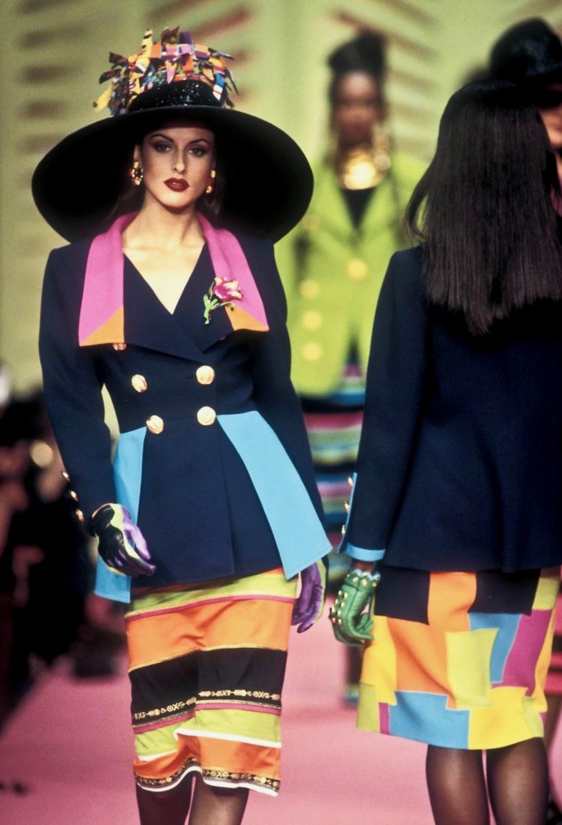 TheRealList presents: a bright color block Christian Lacroix blazer. From the Spring/Summer 1993 collection, a navy version of this jacket debuted on the season's runway. This fabulous double-breasted jacket features bright panels and is made