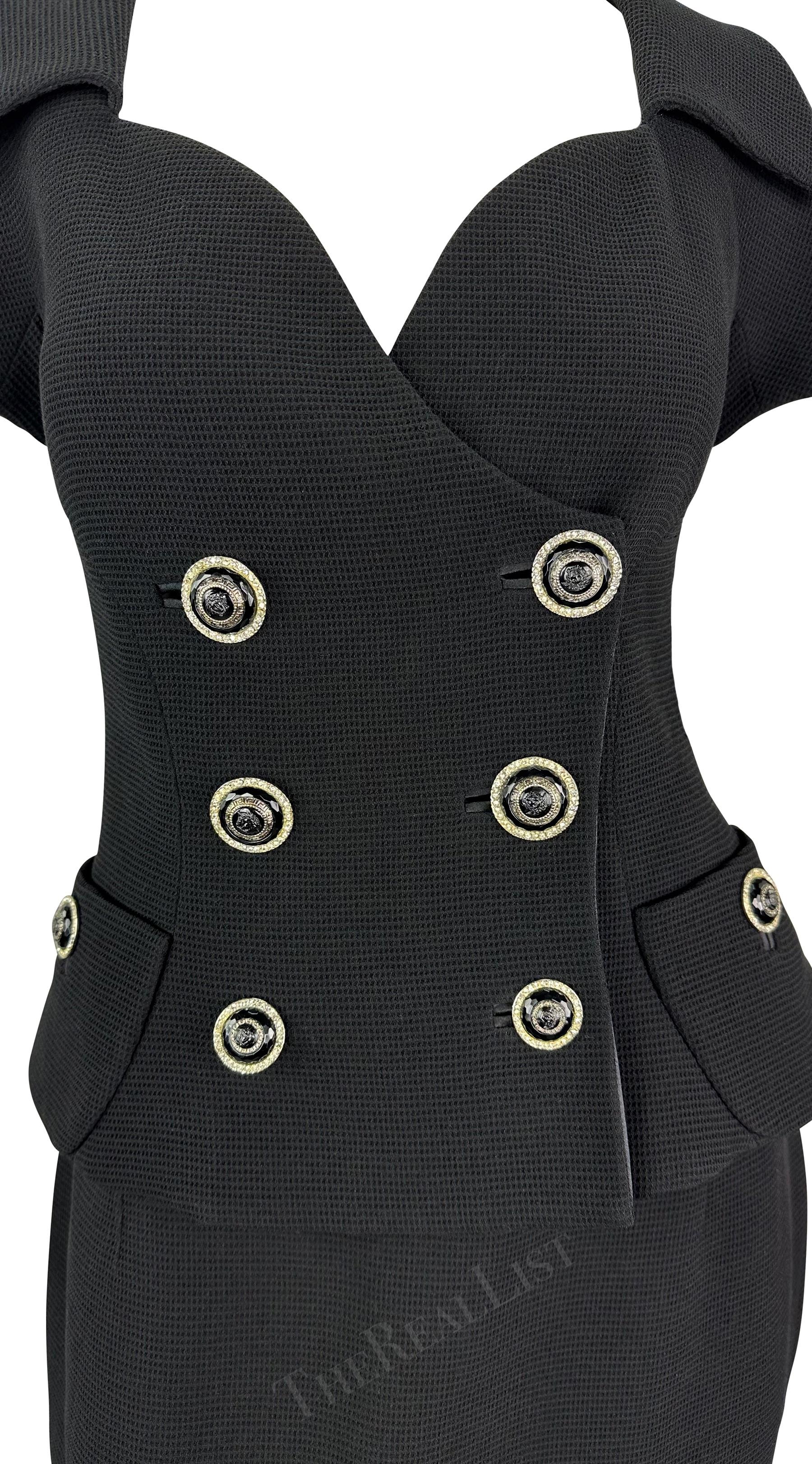 Presenting a fabulous black waffle knit Gianni Versace skirt suit, designed by Gianni Versace. From the Spring/Summer 1993 collection, this skirt suit consists of a short sleeve blazer and matching pencil skirt. The blazer features a double-breasted
