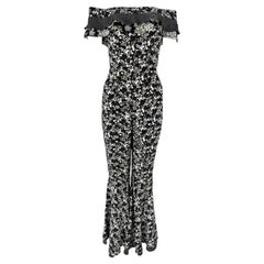 F/S 1993 Gianni Versace Schwarz-Weißer, geblümter Catsuit mit Glockenaufsatz