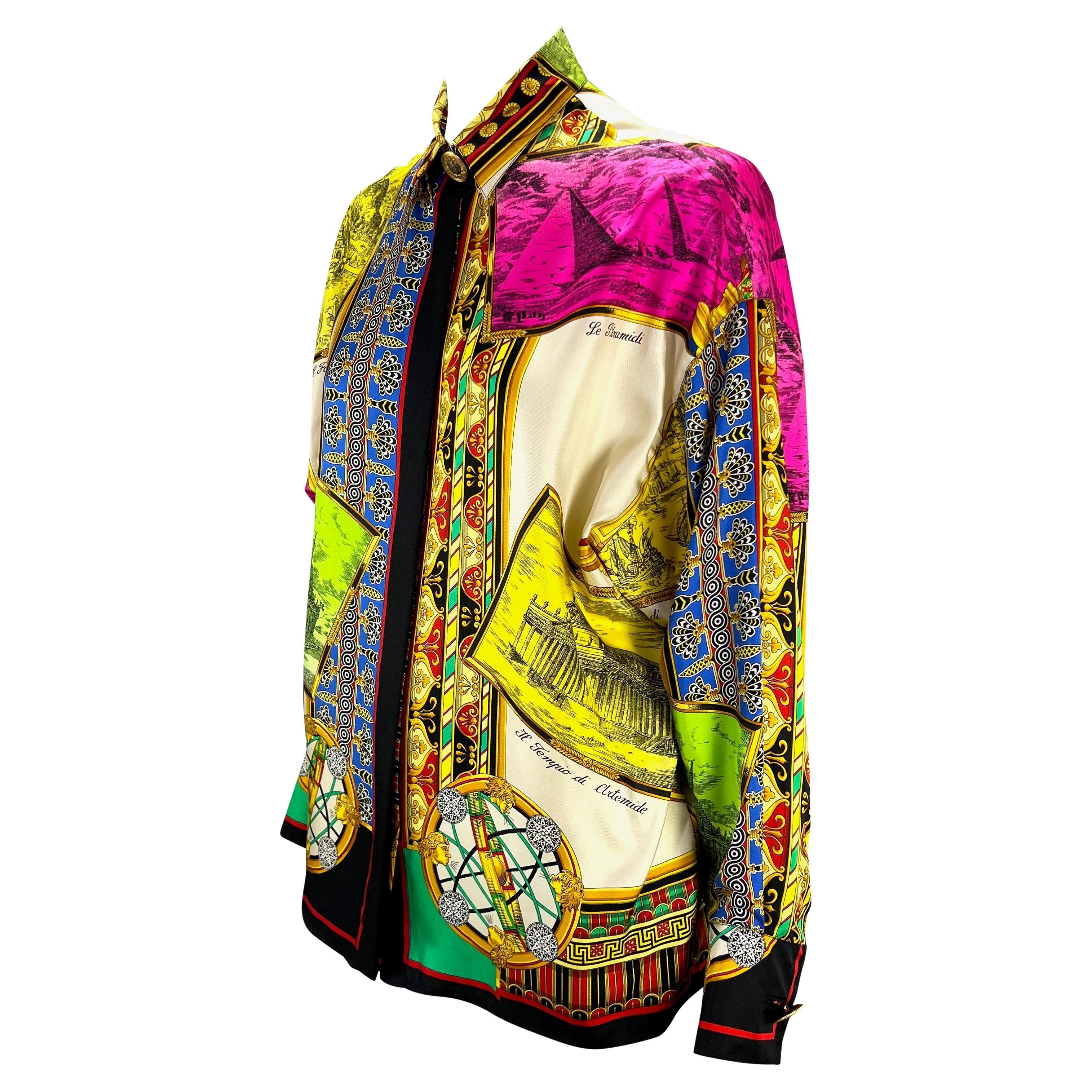 Presenting a stunning silk Gianni Versace Couture button-up shirt, designed by Gianni Versace. Constructed entirely of printed silk, this shirt is covered in the brand's iconic baroque patterns and features a vibrant ancient monument motif. From the