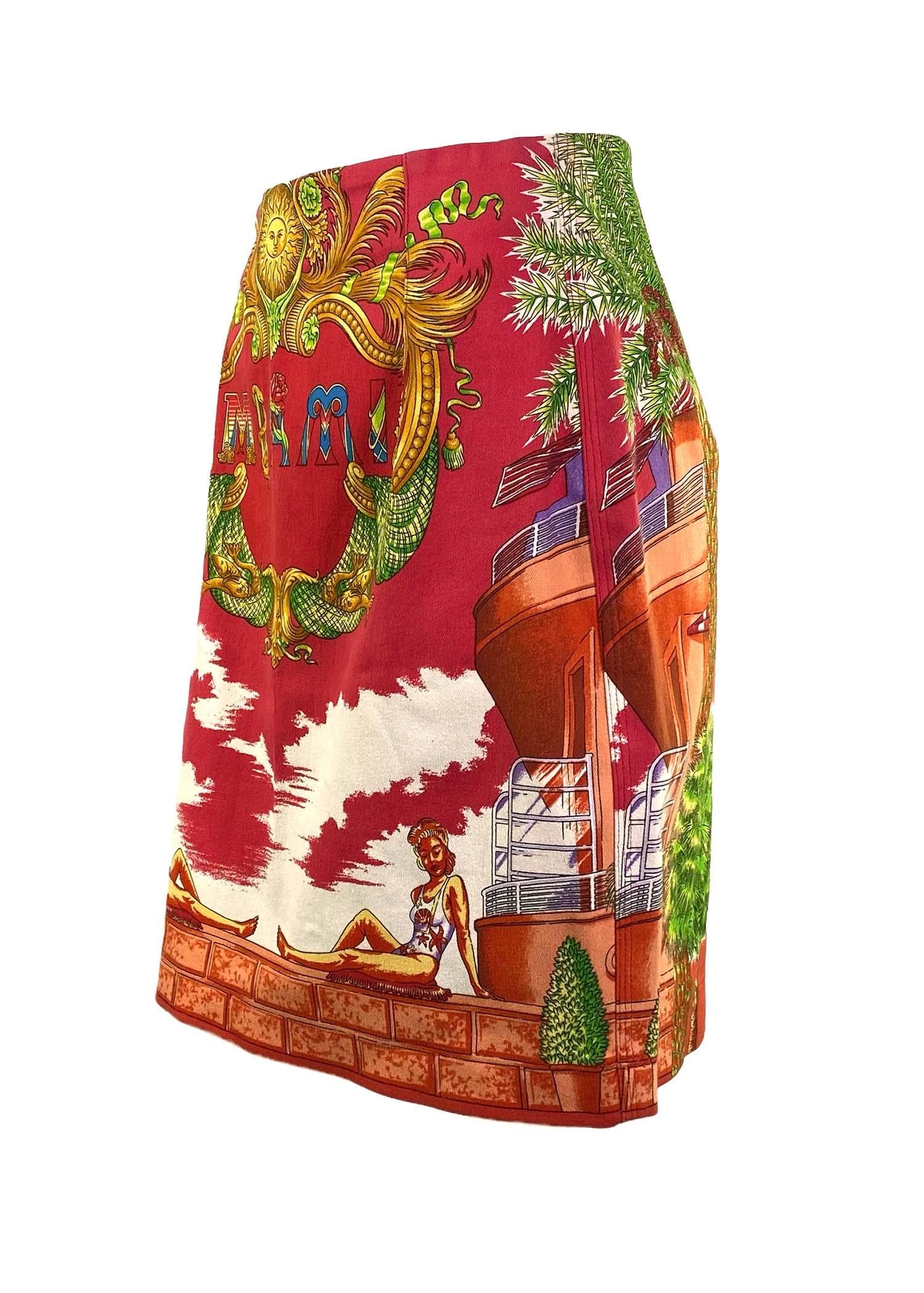 TheRealList presents: the Miami print Gianni Versace skirt of your dreams, designed by Gianni Versace. This skirt from the Spring/Summer 1993 collection, commonly known as the ‘Miami’ collection, features a bright print depicting a beach scene with