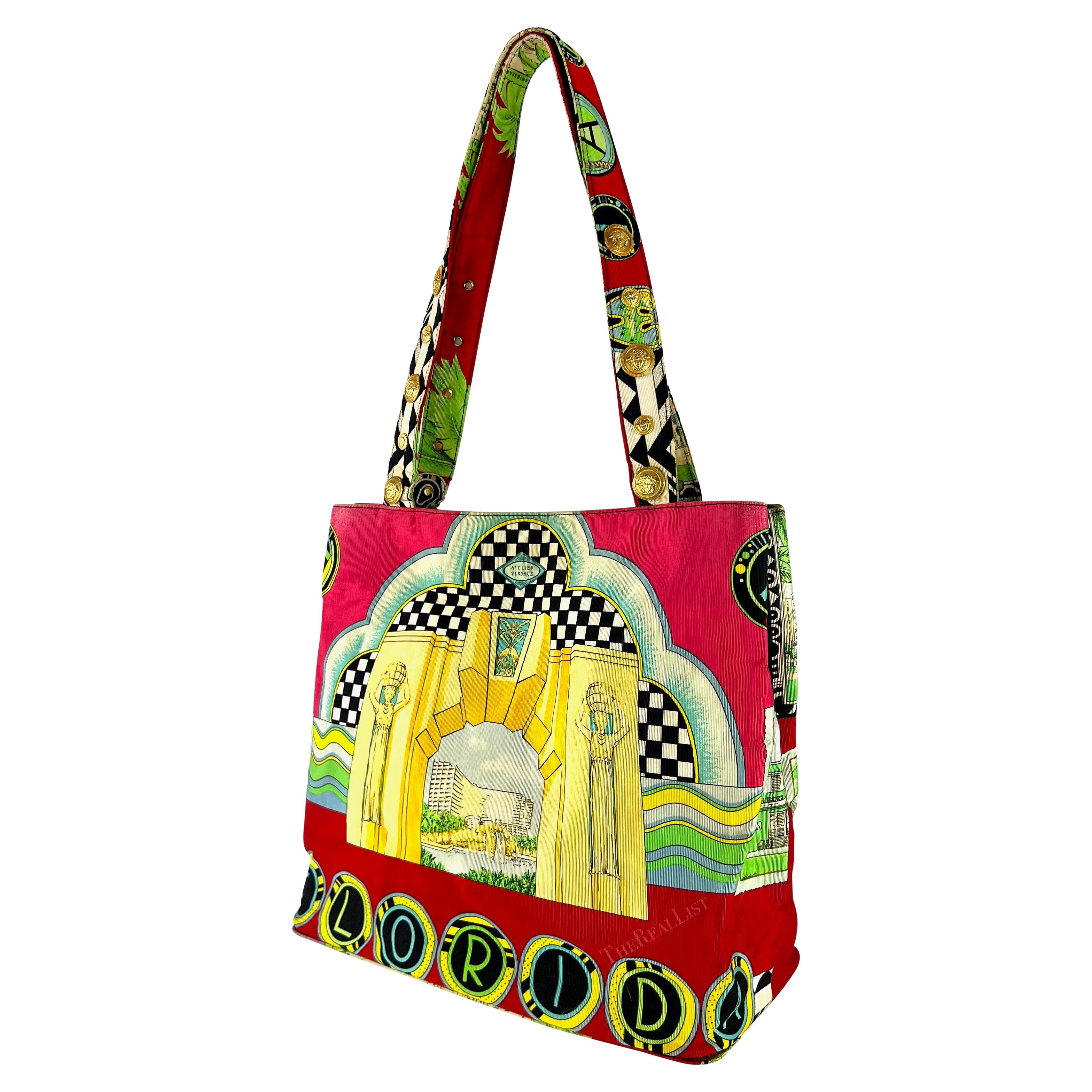 Presenting a fabulous red Miami print canvas tote by Gianni Versace, designed by Gianni Versace for the Spring/Summer 1993 collection. This tote showcases the brand’s iconic Miami motif print, featuring highlights of the city’s architecture. This