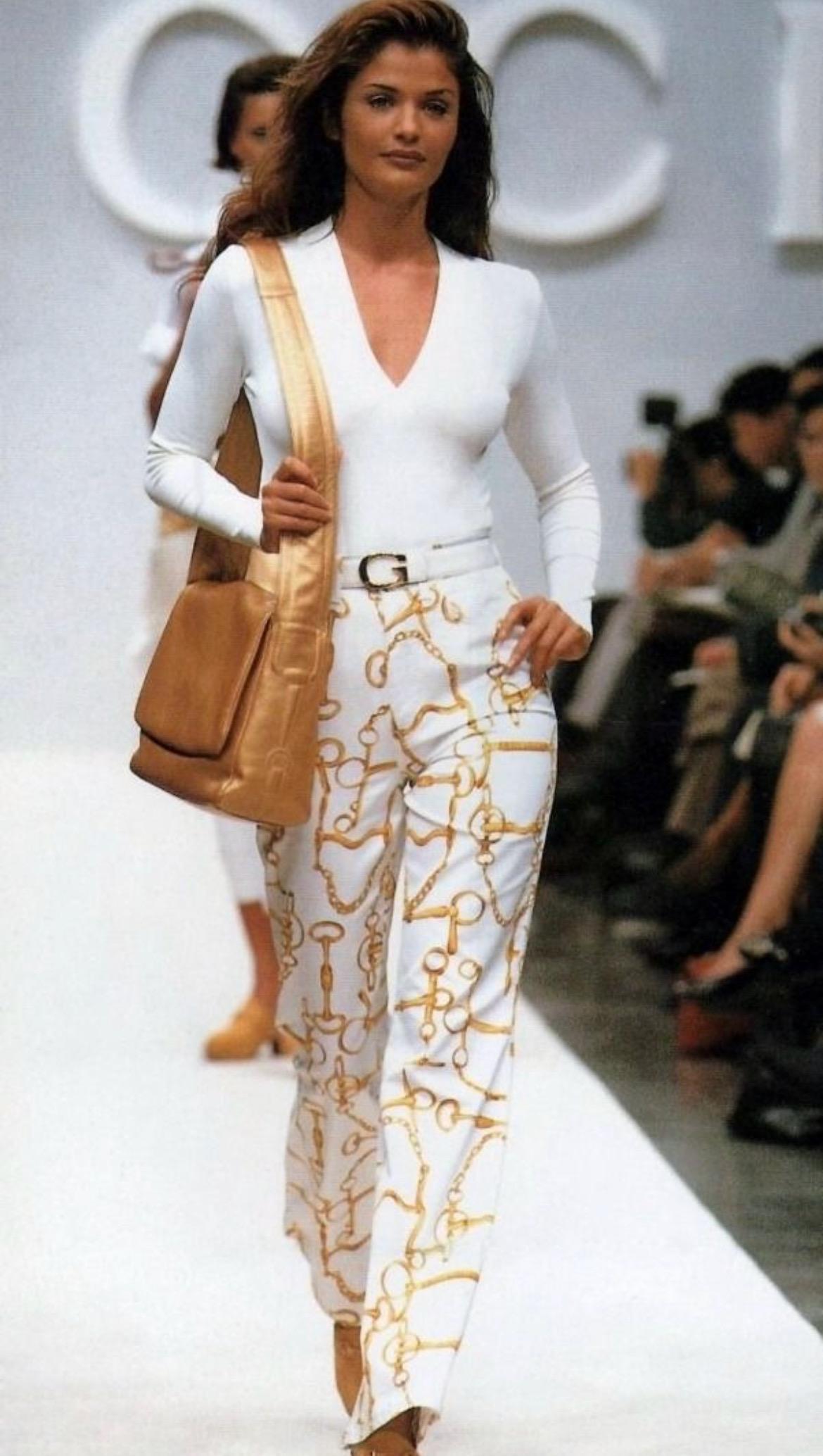 Presenting a pair of fabulous white denim Gucci pants. From the Spring/Summer 1993 collection, similar pants debuted on the season's runway modeled by Helena Christensen and were also used in the season's ad campaign. Perfectly Gucci, these
