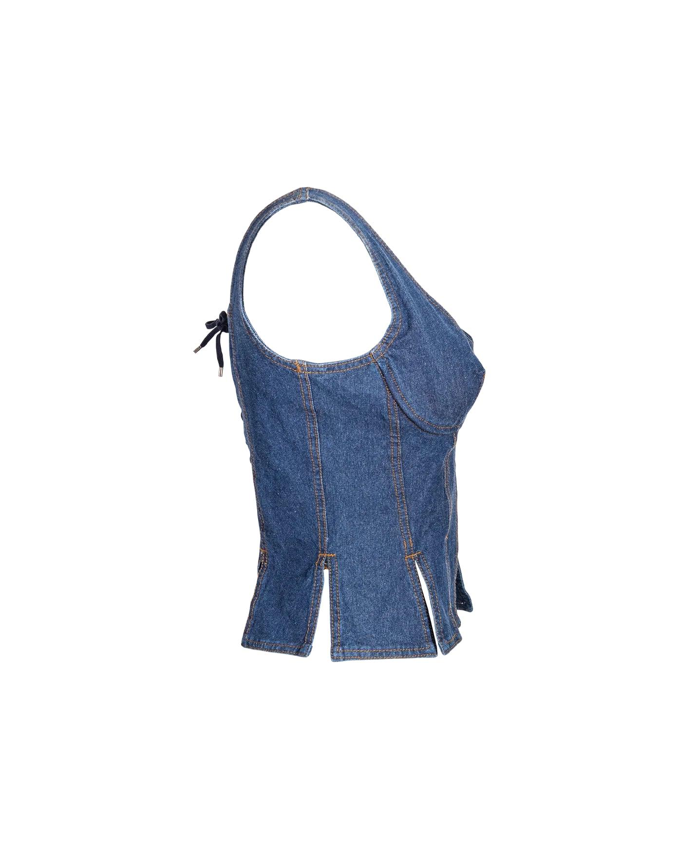 S/S 1993 Jean Paul Gaultier Jeans denim lace-up corset. Denim corset top with structured bra cups. Front zip closure and shoelace tie corset back with silver tone hardware. Similar version seen on Christy Turlington on the runway. 