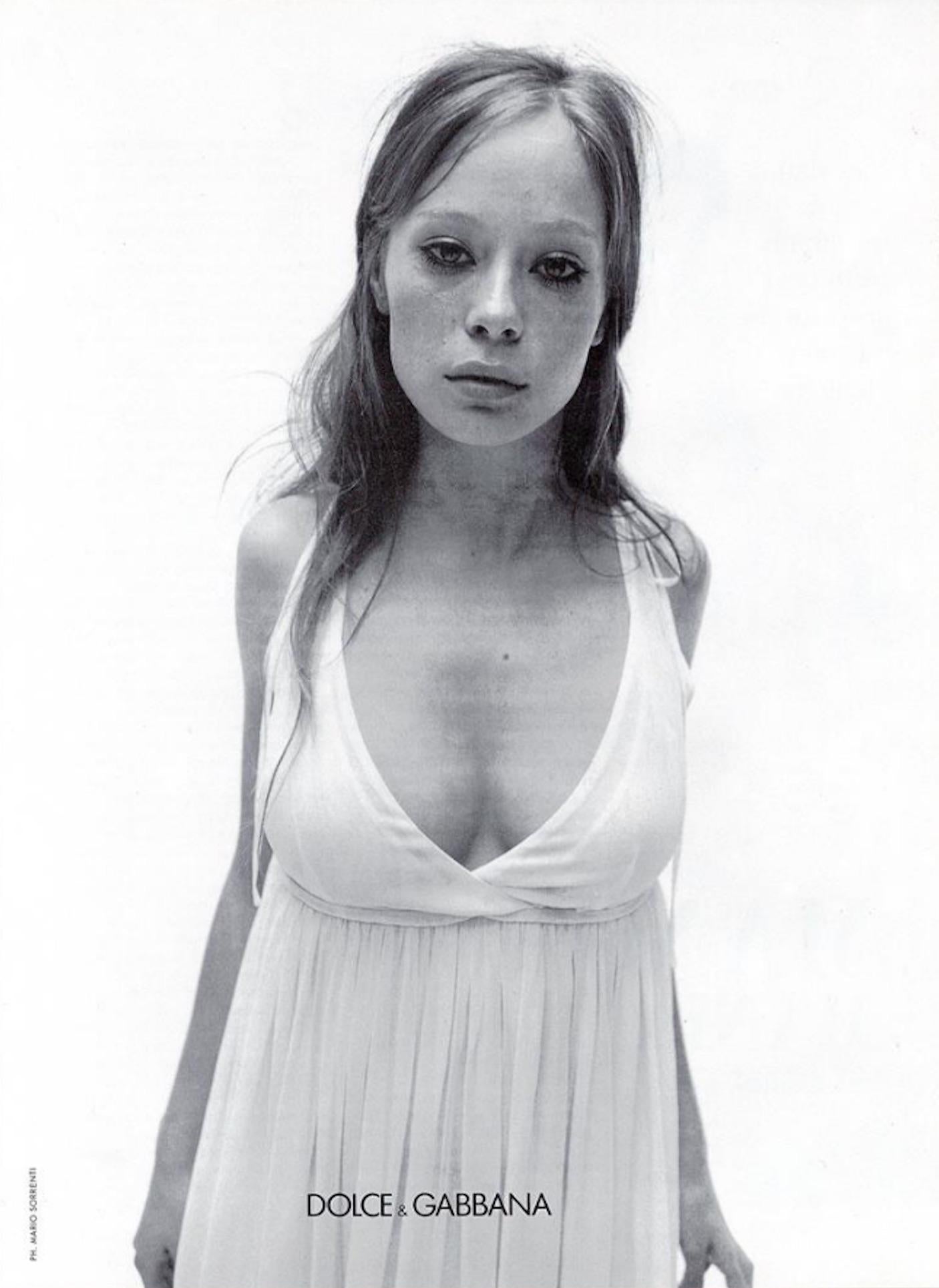 From Dolce & Gabbana’s Spring/Summer 1994 collection, this white chiffon mini dress features a soft scoop neckline, a sheer layered construction, and a delicate tie at the waist. Similar styles debuted on the season’s runway and appeared in the