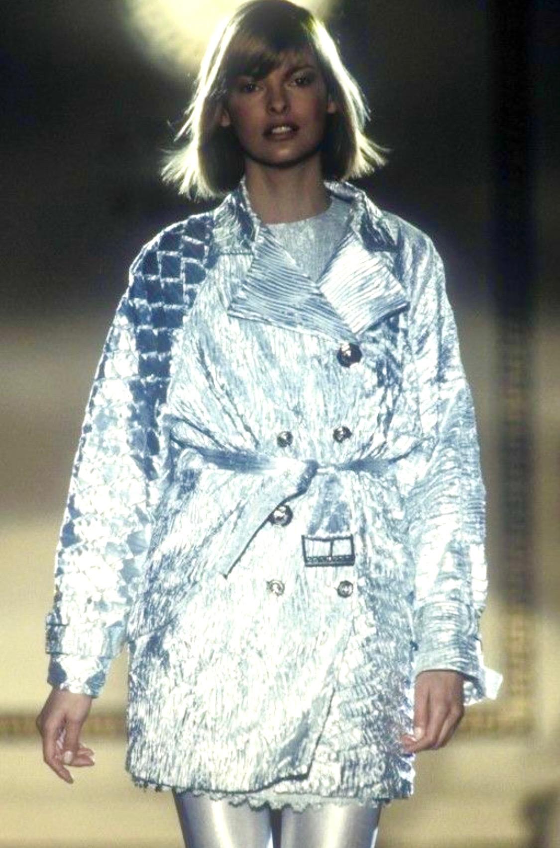 Presenting a rare blue metallic crinkled lamé Gianni Versace Couture coat, designed by Gianni Versace. This rare piece cannot be found on a ready-to-wear runway, but the fabric debuted on the Atelier Versace Spring/Summer 1994 Haute Couture runway,