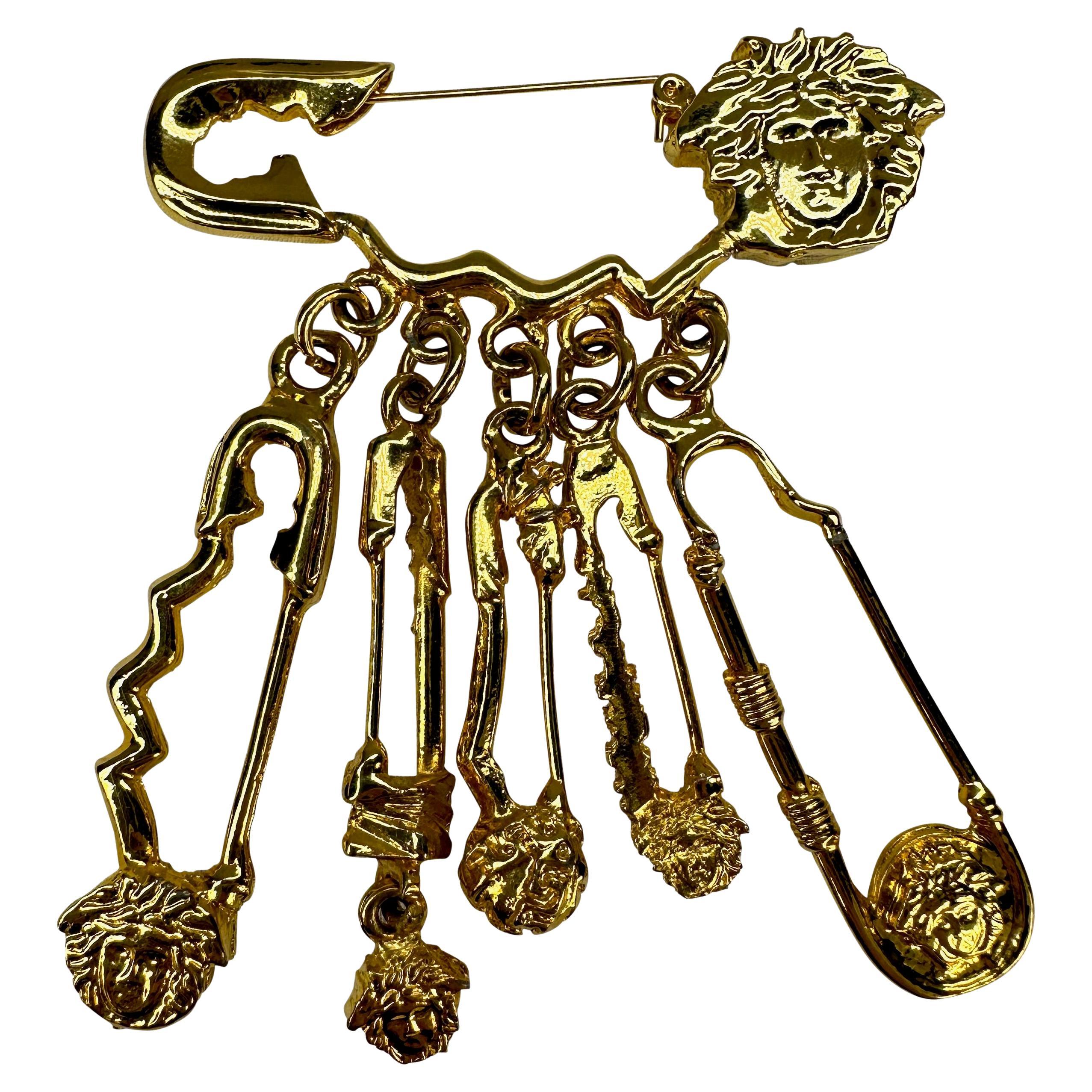 S/S 1994 Gianni Versace Gold Tone Medusa Logo Safety Pin Costume Brooch In Excellent Condition For Sale In West Hollywood, CA