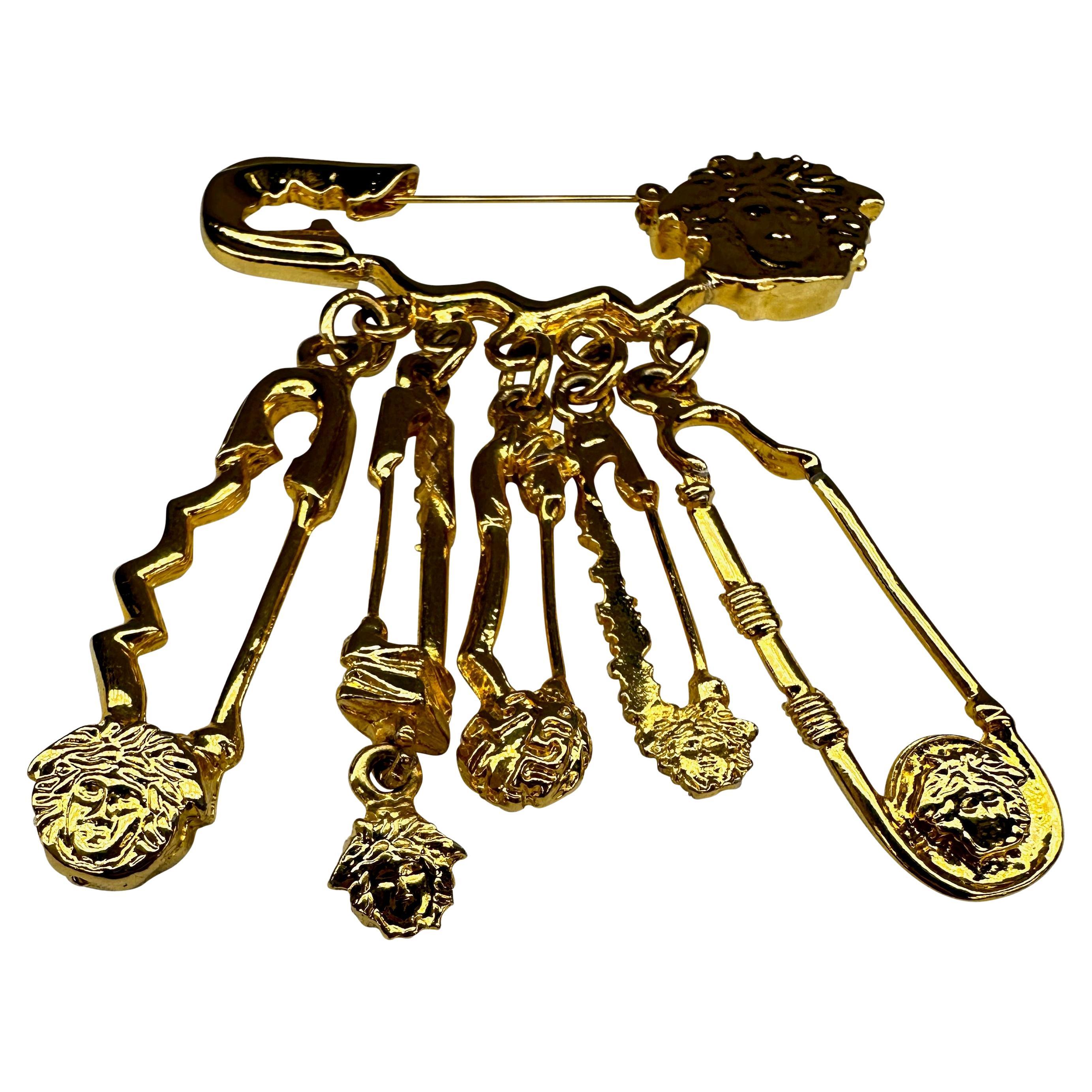 Women's or Men's S/S 1994 Gianni Versace Gold Tone Medusa Logo Safety Pin Costume Brooch For Sale