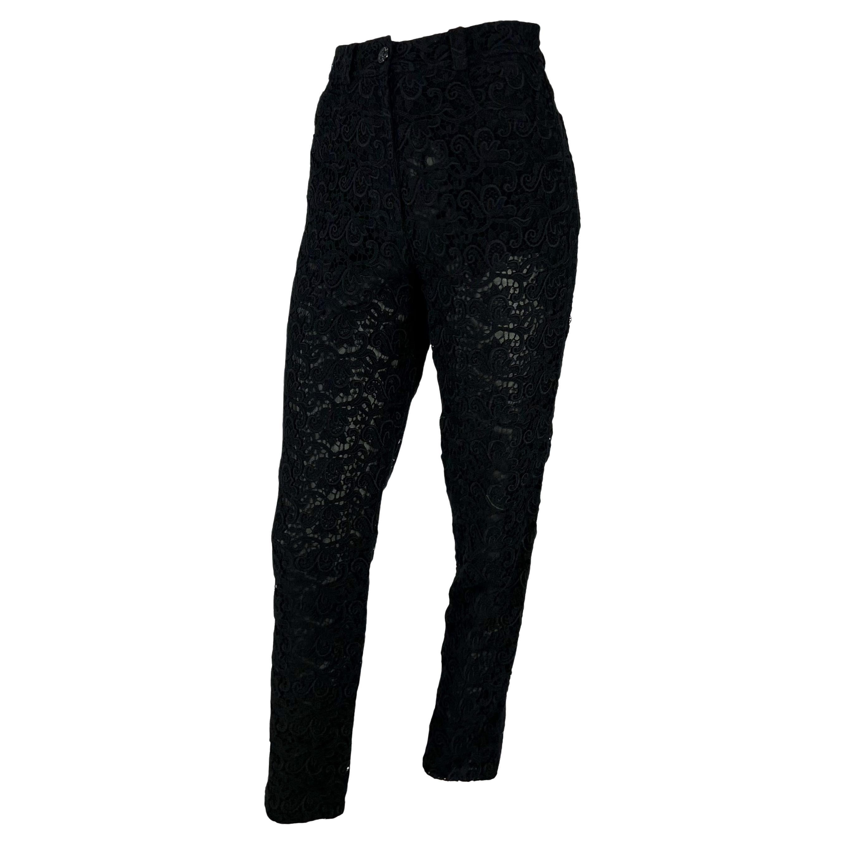 Presenting a pair of black lace Gianni Versace Couture pants, designed by Gianni Versace. From the Spring/Summer 1994 collection, these pants are constructed entirely of intricate lace with a sheer black lining underneath. These pants are made