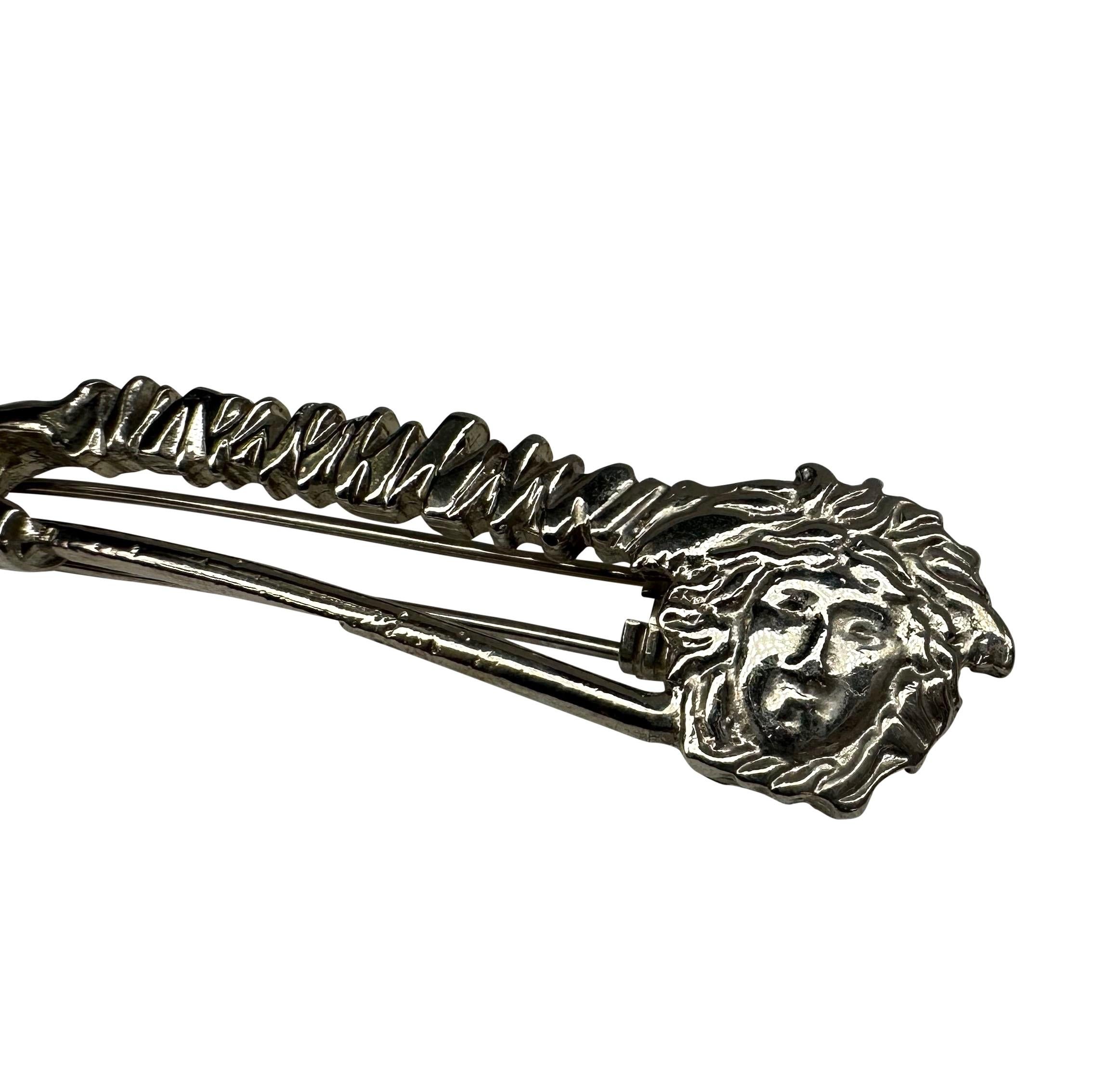 Presenting an incredible silver-tone Gianni Versace Medusa hair clip, designed by Gianni Versace. From the Spring/Summer 1994 collection, this oversized safety pin barrette features a Versace Medusa logo. One of Gianni Versace's most iconic house