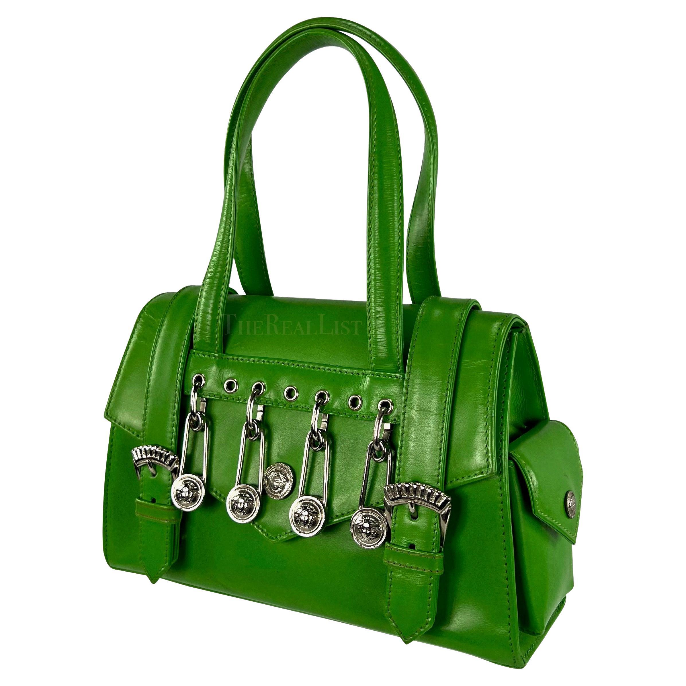 Presenting a fabulous bright green Gianni Versace safety pin mini bag, designed by Gianni Versace. A legendary creation from Gianni Versace's S/S 1994 collection, forever intertwined with Elizabeth Hurley's iconic 'Safety Pin' dress. This petite bag