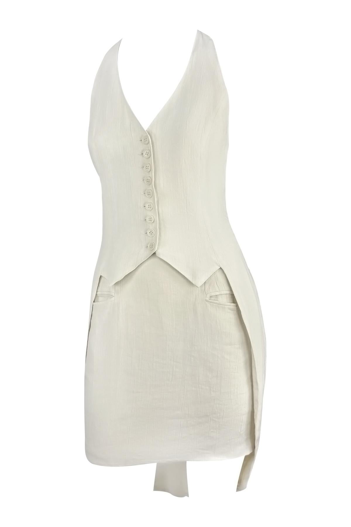 From Norma Kamali’s Spring/Summer 1994 runway collection, this off-white set is crafted from crinkled linen and features a sharply tailored vest with a button front and pointed hem. The coordinating high-waisted skirt features a tapered silhouette,