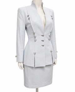 Primavera/Estate 1994 Thierry Mugler: completo con gonna traforata in metallo blu ghiaccio