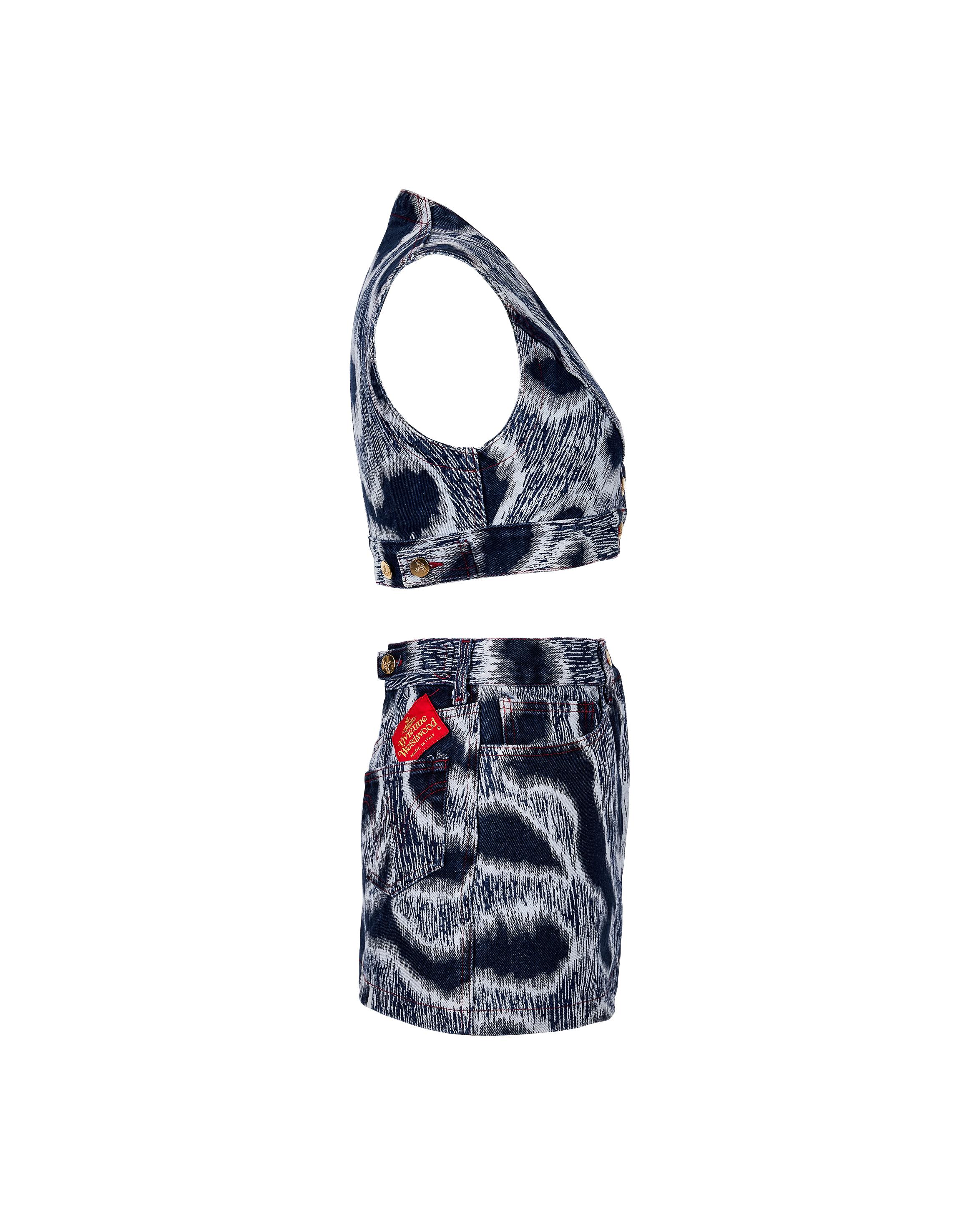 S/S 1994 Vivienne Westwood 'Cafe Society' blue leopard print denim bustier and skirt set. Red contrast stitching throughout. Short bustier vest top with signature orb gold buttons and scoop neck. Denim micro miniskirt features Westwood orb button,