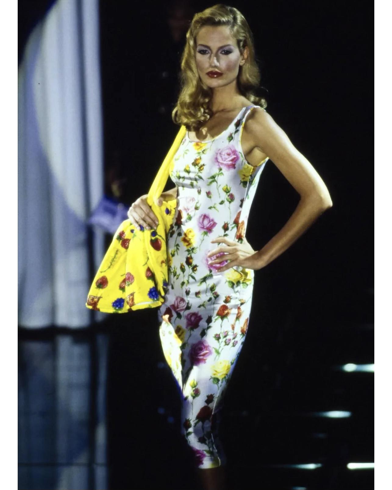 S/S 1995 Gianni Versace white scoop neck midi dress with floral print throughout. Lightweight stretch nylon material, perfect for summer. Concealed side zip closure. As seen on Karen Mulder on the runway. Note: waist measurement stretches up to 13