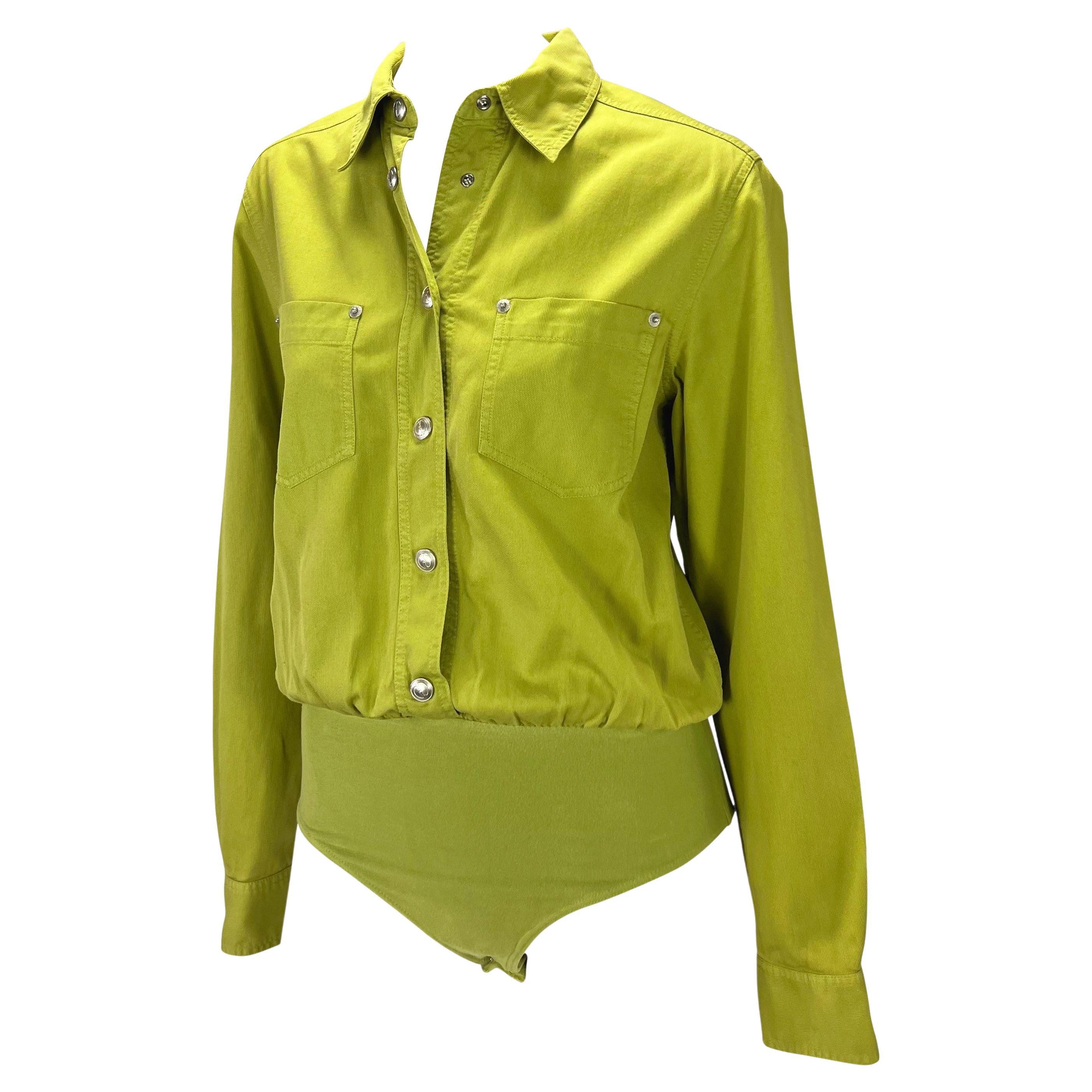 Presenting a chartreuse Gucci leotard top, designed by Tom Ford. From the Spring/Summer 1995 collection, this top features a classic button-down shirt style elevated with two pockets at the bust and silver 'GG' button snap closures throughout. The
