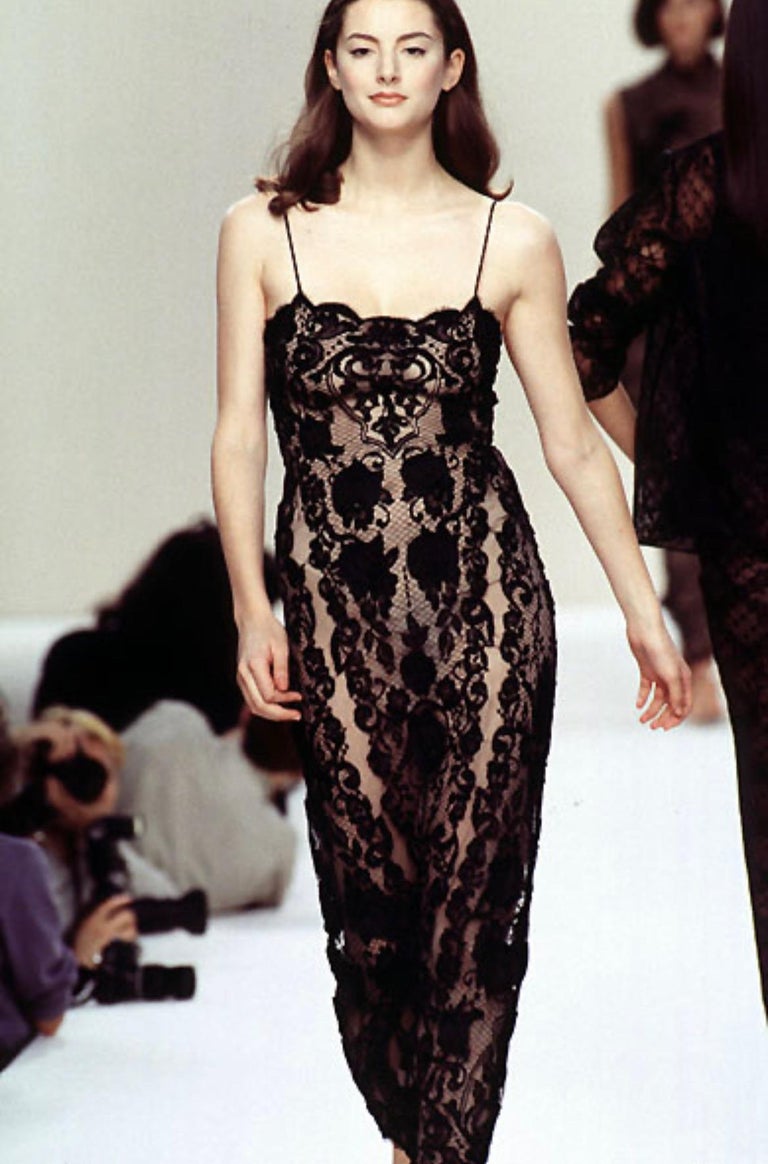 TheRealList presents: a beige with black lace Bill Blass Couture slip dress, designed by Bill Blass. From the Spring/Summer 1996 collection, this fabulous dress debuted on the season's runway a features a square neckline and spaghetti straps.