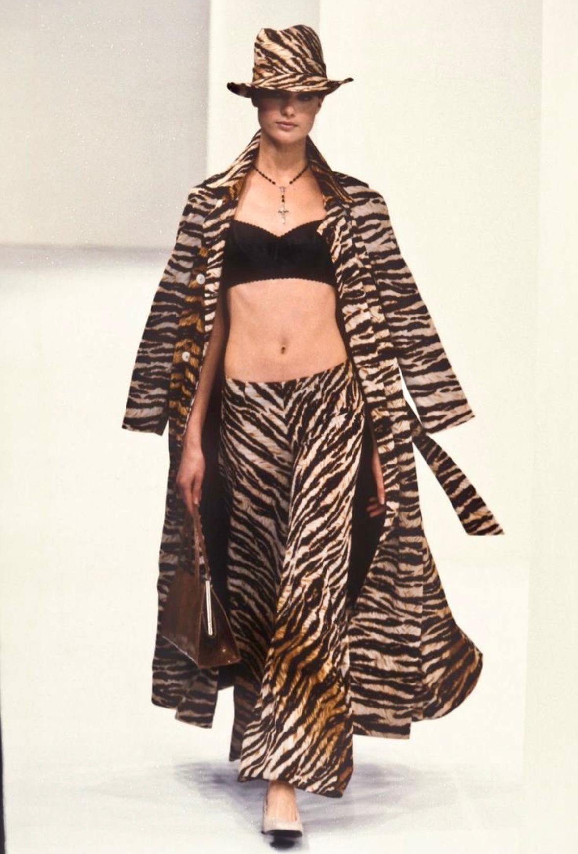 Debuting on Dolce & Gabbana’s Spring/Summer 1996 collection runway on Shalom Harlow, these sheer wide-leg pants feature an oversized silhouette and bold tiger print.

Approximate measurements: 
Size - removed 
Waist: 32