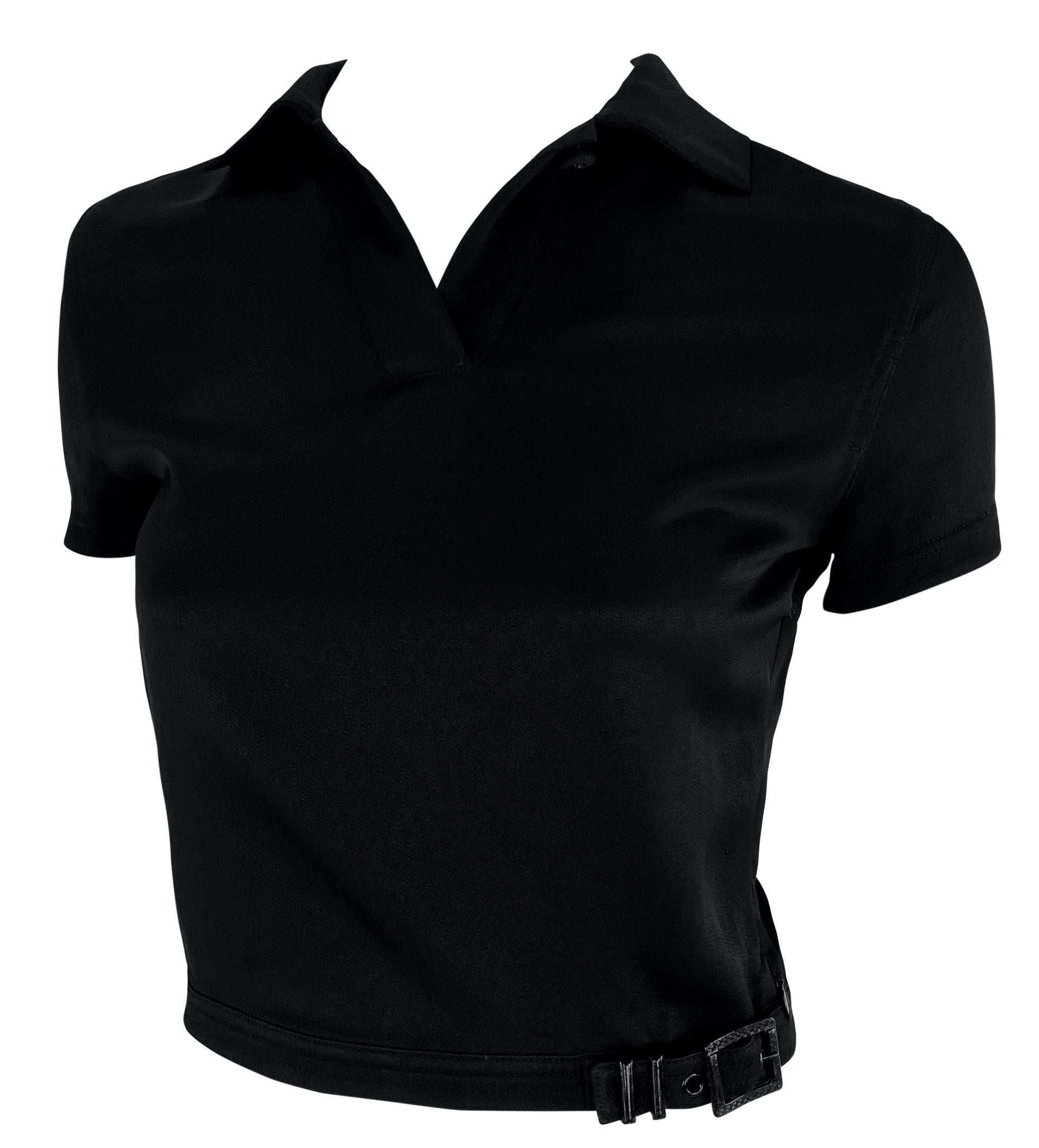 This chic black crop top from Gianni Versace’s Spring/Summer 1996 collection features a sharp collared neckline and a unique buckle detail at the waist.

Approximate measurements:
Size - Removed
Shoulder to hem: 17
Bust: 32” - 34”
Waist: 24” -