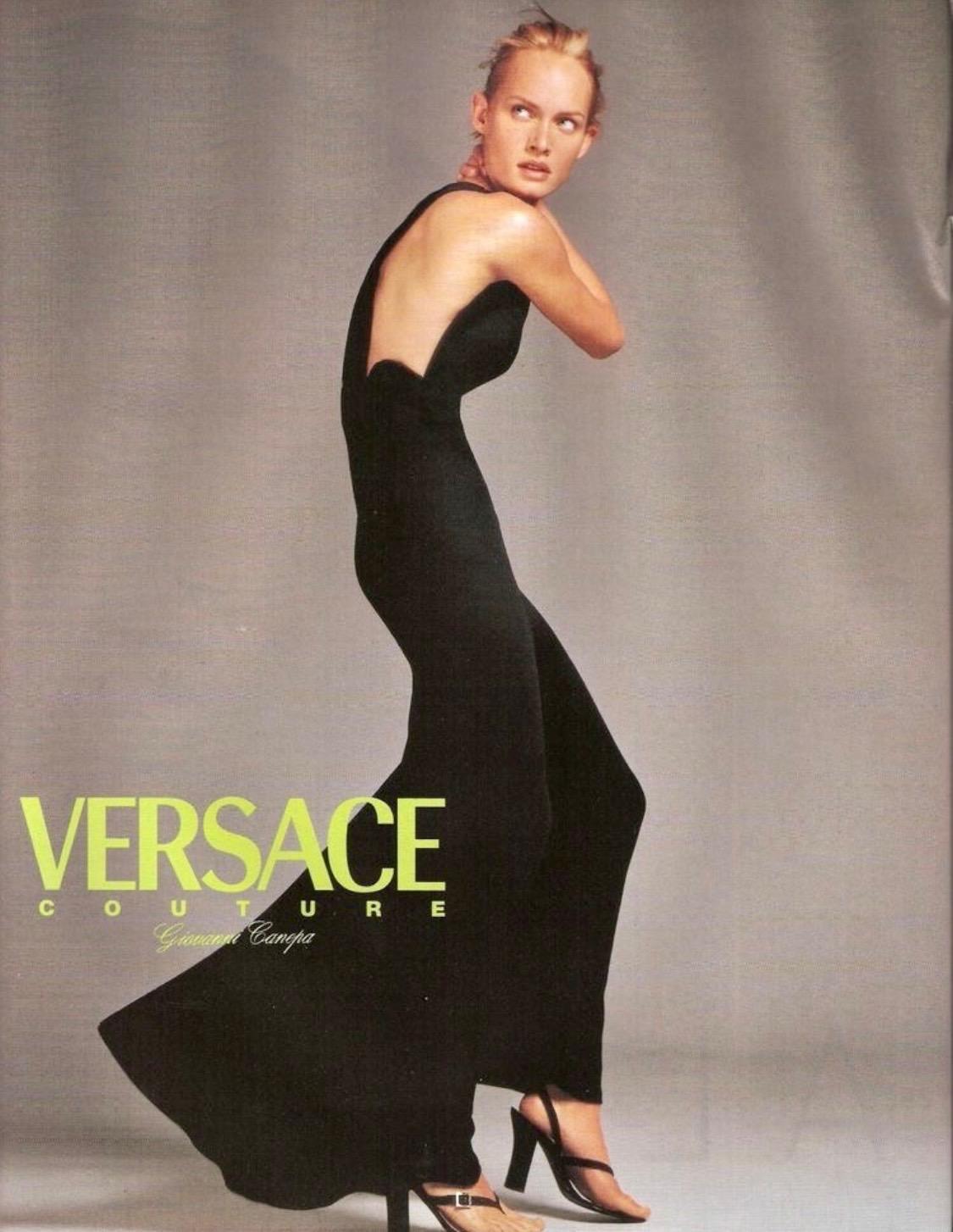 Presenting a black scallop-edged full-length gown designed by Gianni Versace for his Spring/Summer 1996 collection. Princess Diana famously wore a purple version of this gown to a fundraising gala dinner in Chicago on June 5th, 1996. A version of