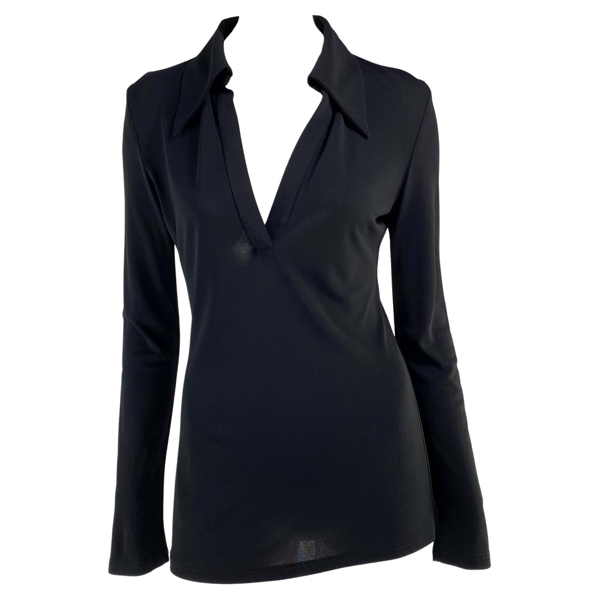 Presenting a collared v-neck tunic top, designed by Tom Ford. This top has long sleeves, a prominent collar, and a deep v-neckline. Not your average top, this shirt was designed for the Spring/Summer 1996 collection and is the perfect chic elevation