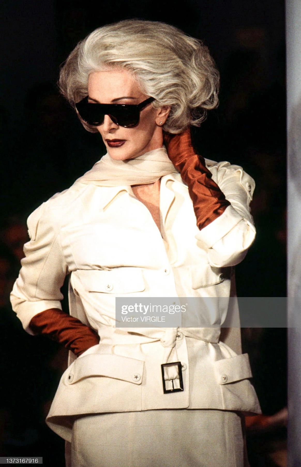 Presenting a fabulous khaki Thierry Mugler skirt suit, designed by Manfred Mugler. From the Spring/Summer 1996 collection, a version of this fabulous set debuted on the season's runway modeled by Carmen Dell'Orefice. The blazer features pockets at