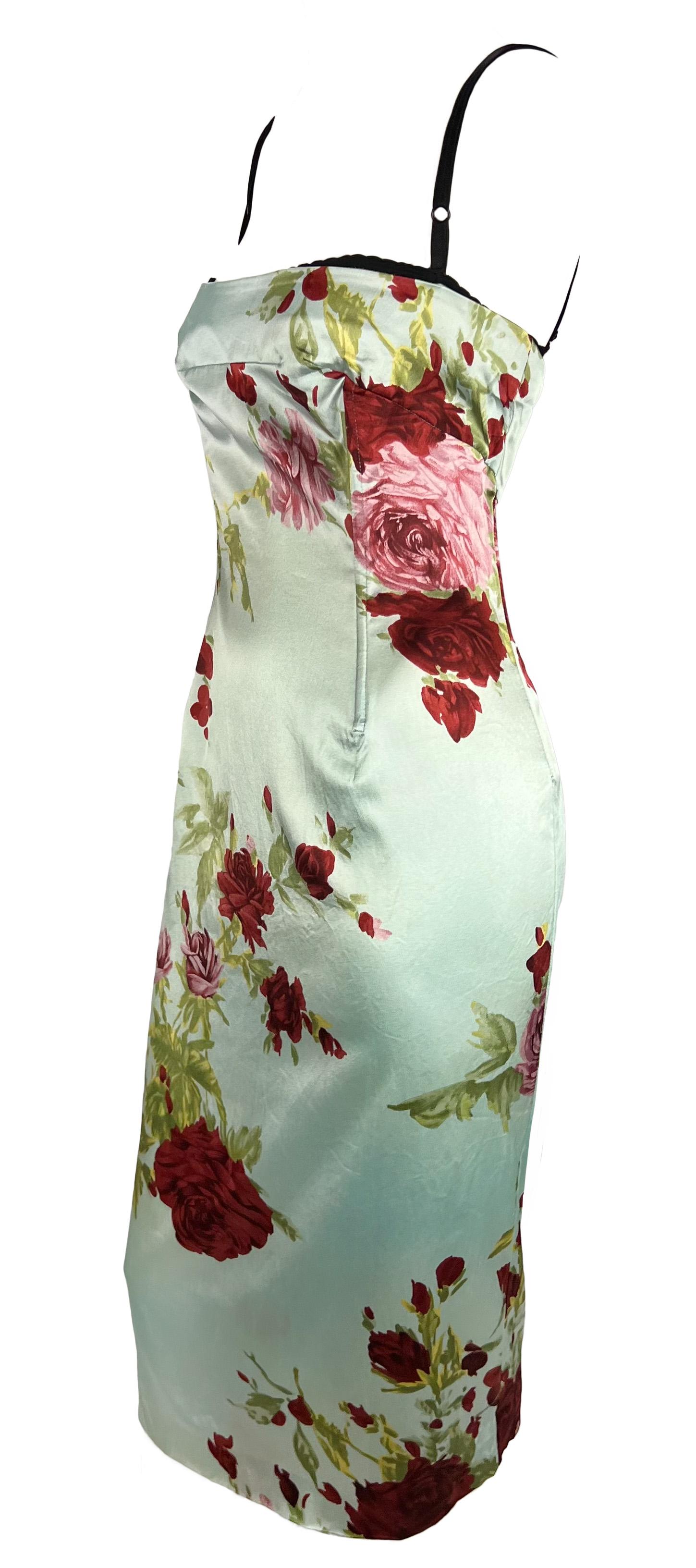 This stunning baby blue satin dress by Dolce & Gabbana from their Spring/Summer 1997 collection is a fabulous floral addition to any wardrobe. It features a beautiful floral print, boning at the waist for structure, a built-in bra for support, and a