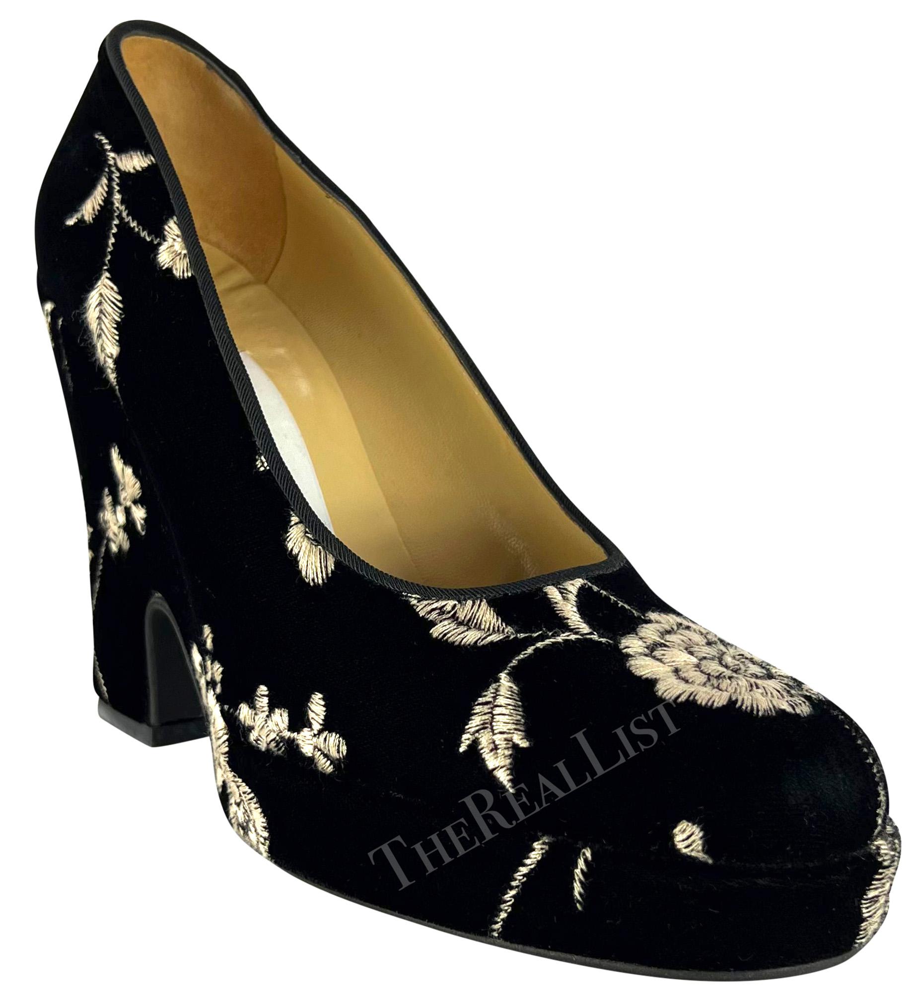 From the Spring/Summer 1997 collection, these black velvet Dolce & Gabbana platform heels feature a small platform and are made complete with an embroidered white floral pattern, that debuted on the season's runway. Never worn before, these heels