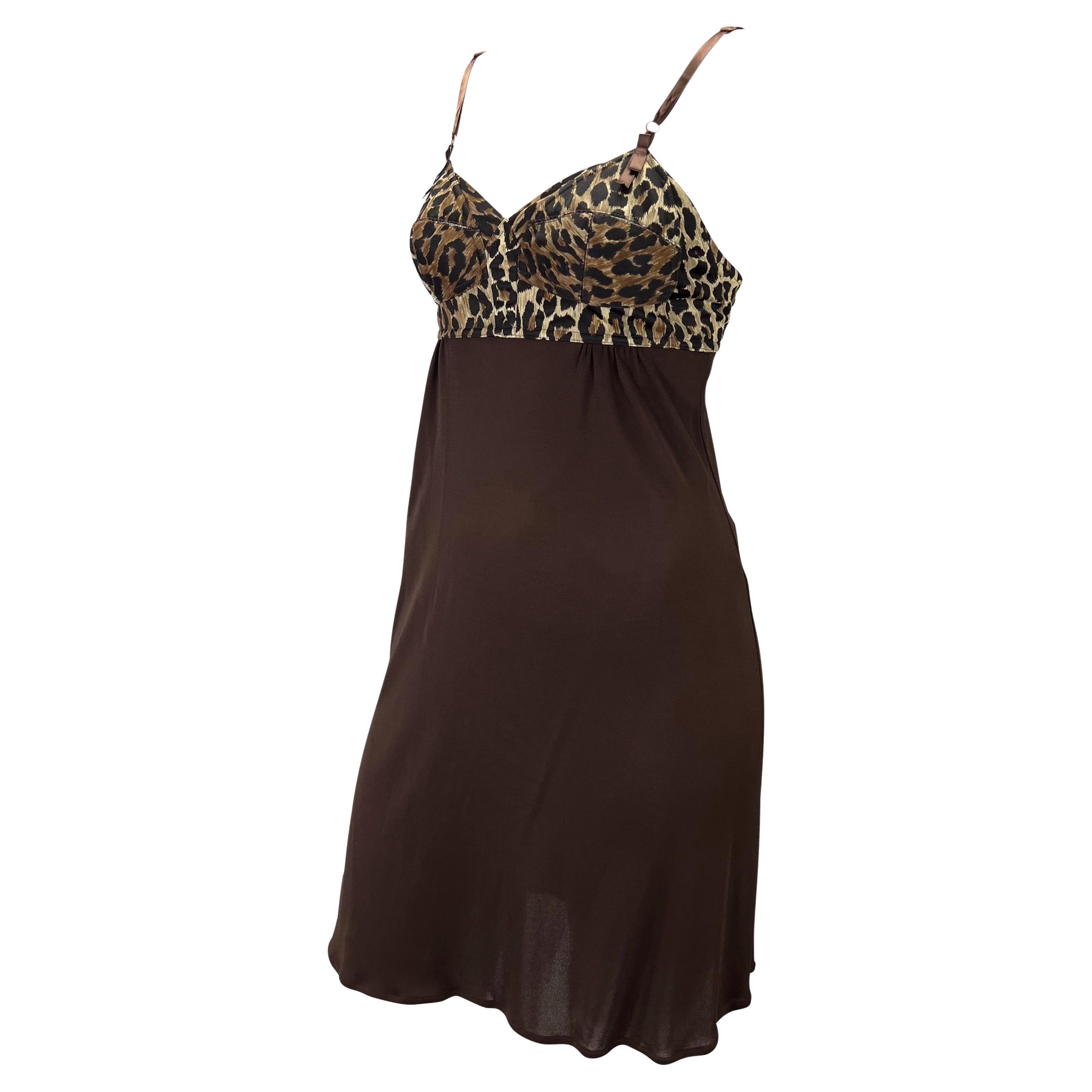 Presenting a brown cheetah print Dolce and Gabbana slip dress. From the Spring/Summer 1997, this beautiful dress features a cheetah print bust with a brown skirt. Made complete with a tie at the back, this lingerie-esque this piece is the perfect