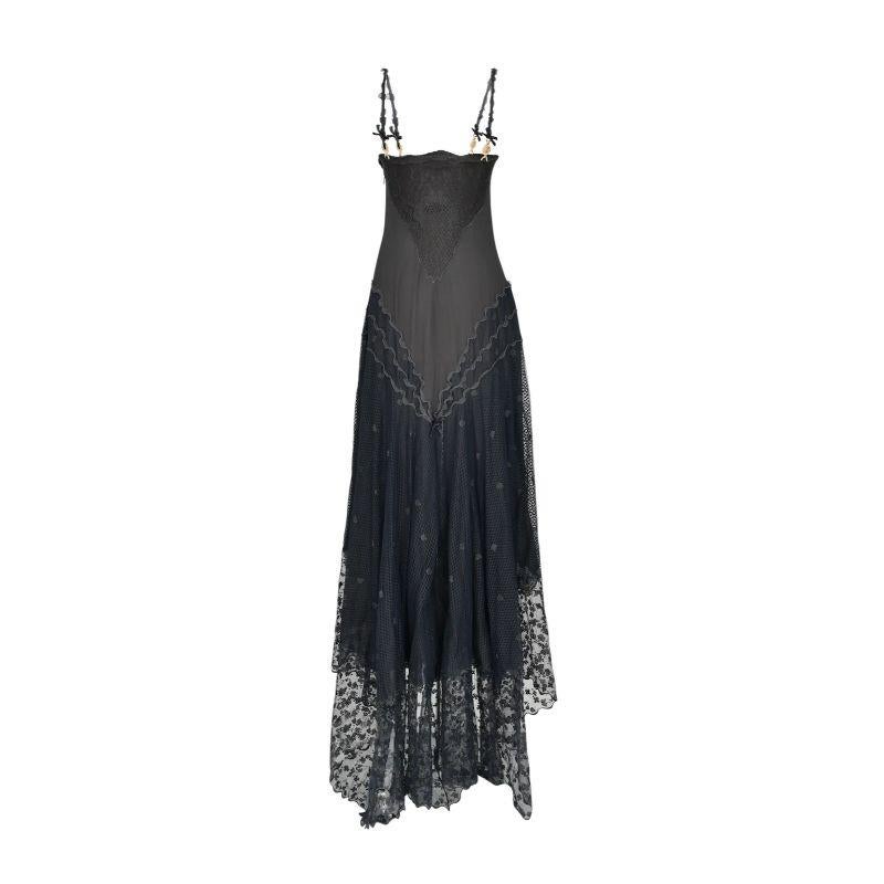 S/S 1997 Gianni Versace Couture charcoal gray lace net side panel silk evening gown. Full length gown with scallop neckline and spaghetti straps detailed with small silk bows and gold Gianni Versace 'G' Coin adornments. The final look of the