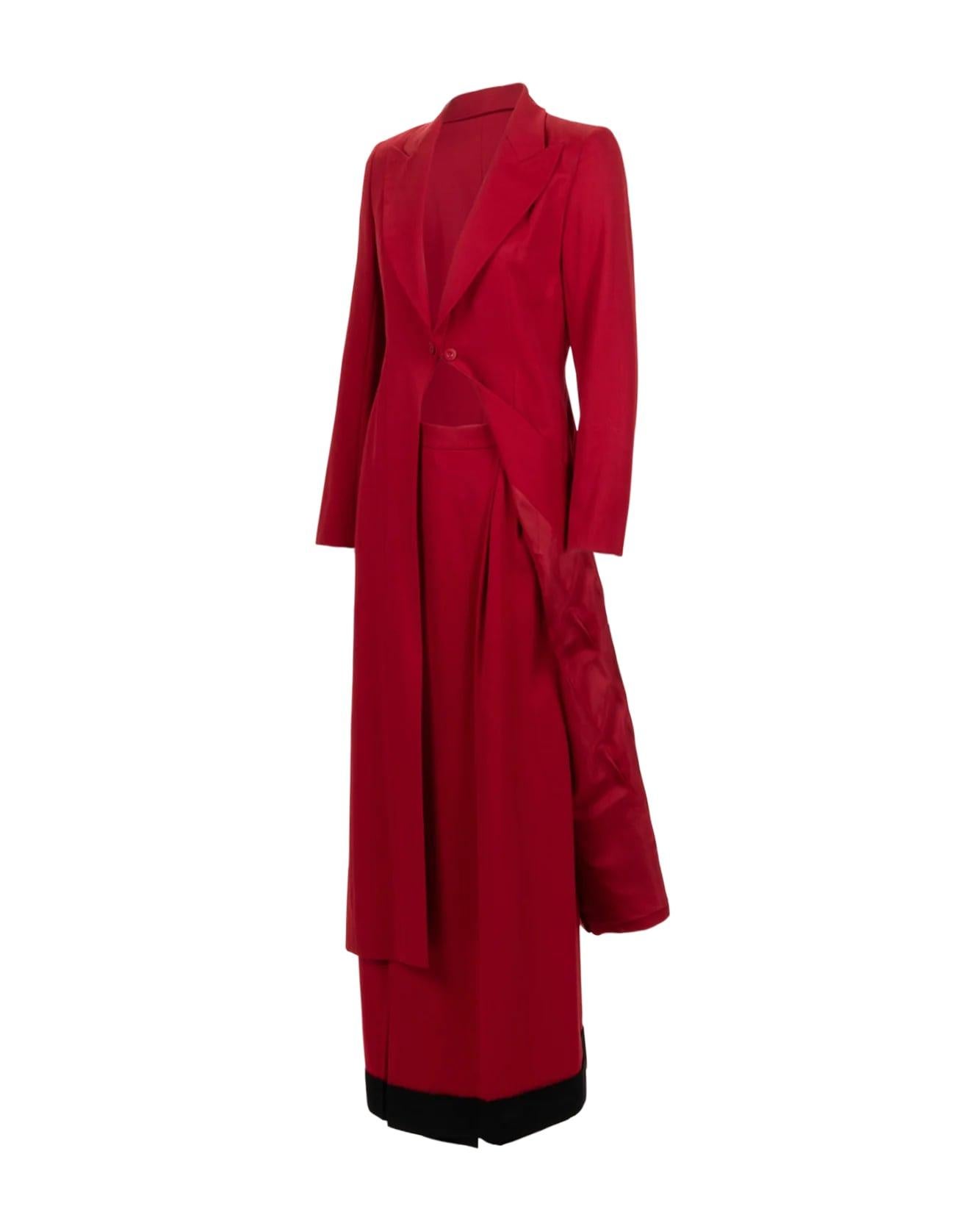 S/S 1997 Givenchy Couture by Alexander McQueen red wool two-piece pant set. Long red jacket with peaked lapel, and front bust closure. Wide leg wrap pants with black wool trim at hem. As seen on the runway in inverted colorway.