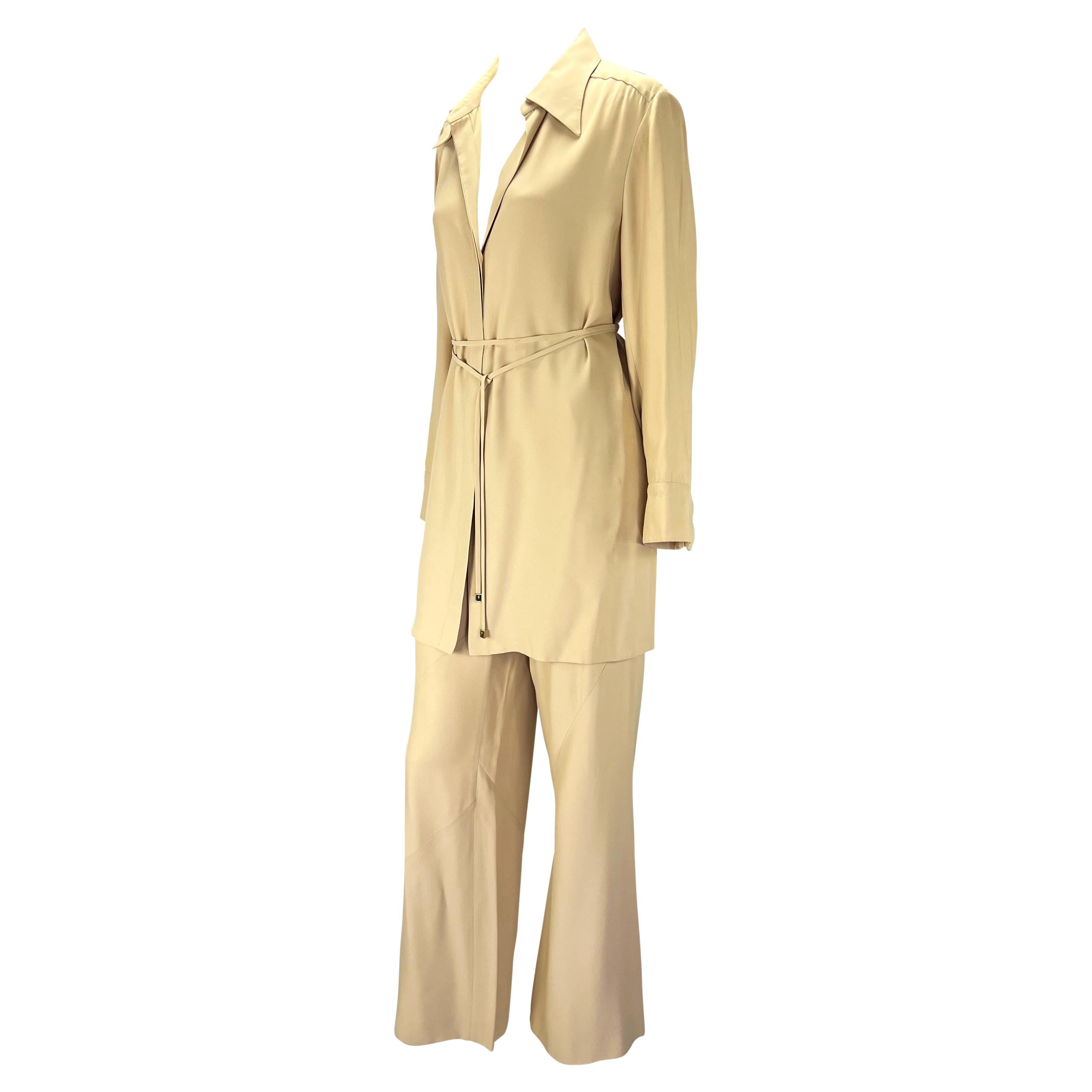 Presenting an incredible beige Gucci pant set, designed by Tom Ford. From the Spring/Summer 1997 collection, this matching two-piece set is made up of an oversized tunic and matching pants. The button closure stops halfway up the front of the tunic