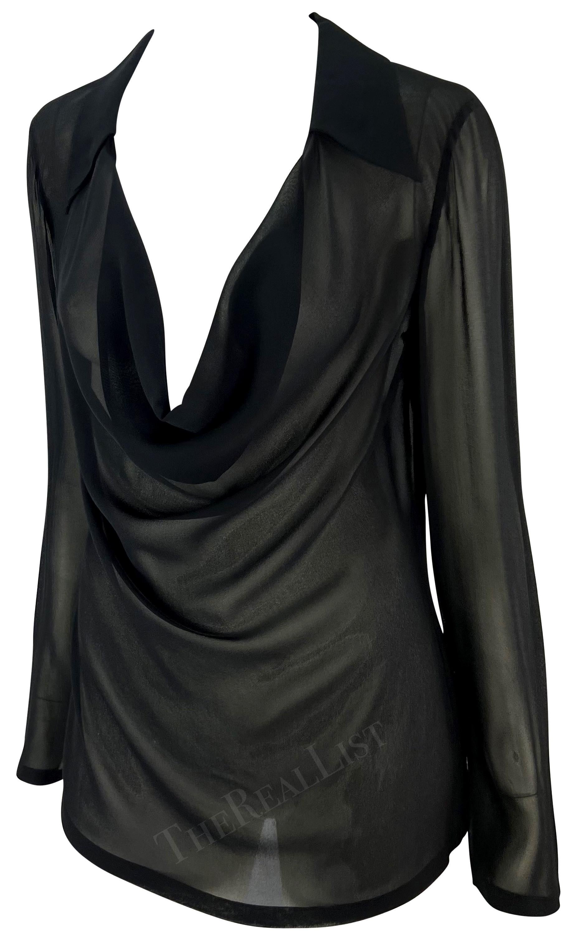 Presenting a fabulous black sheer Gucci blouse, designed by Tom Ford. From the Spring/Summer 1997 collection, this entirely sheer black top features a plunging cowl neckline, a fold-over collar, and lightly belled sleeves.

Approximate