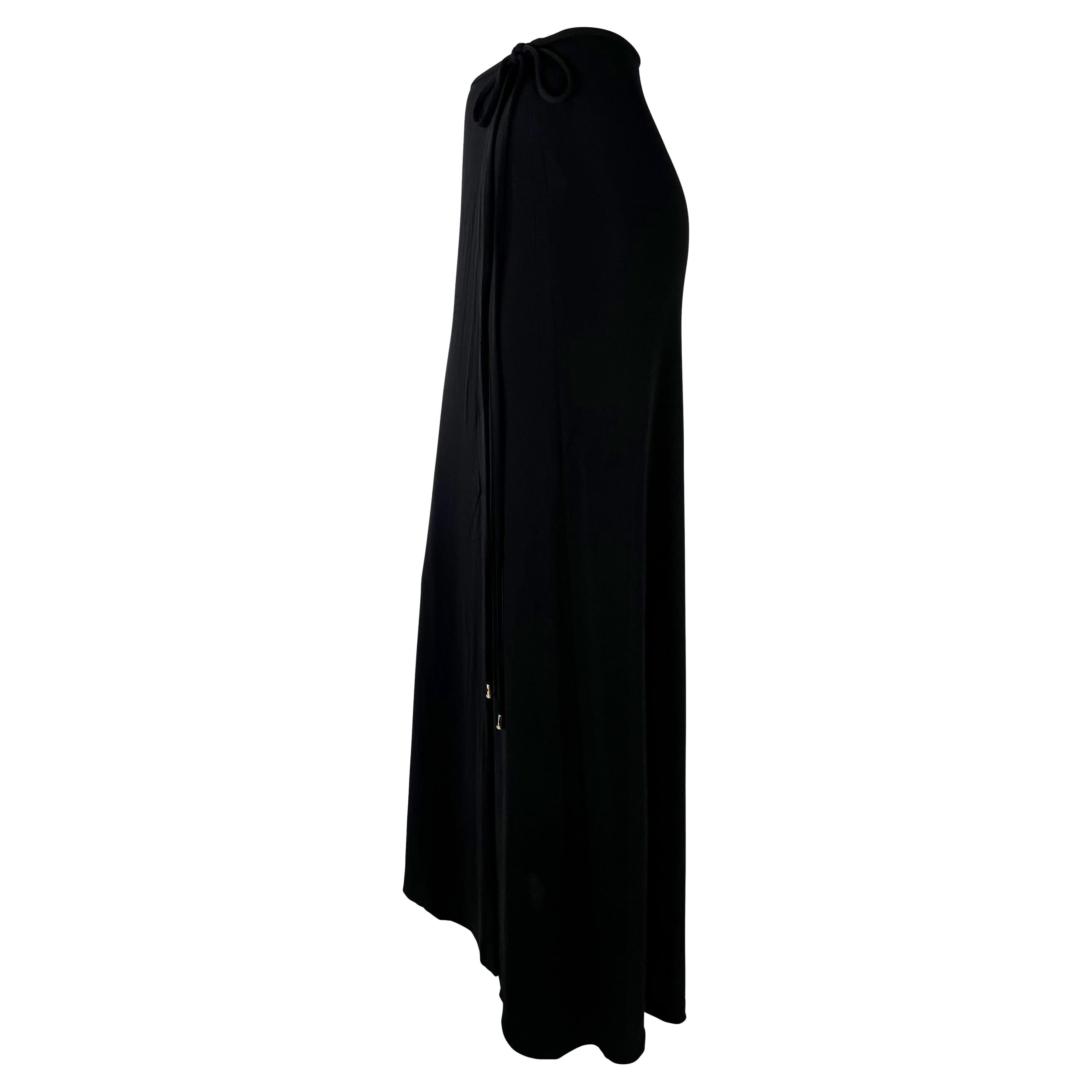 Presenting a chic black wrap maxi skirt designed by Tom Ford for Gucci's Spring/Summer 1997 collection. Constructed in 100% viscose, this stretchy skirt beautifully hugs the wearer. Gold-toned G logo hardware accents the tie closure for a subtle
