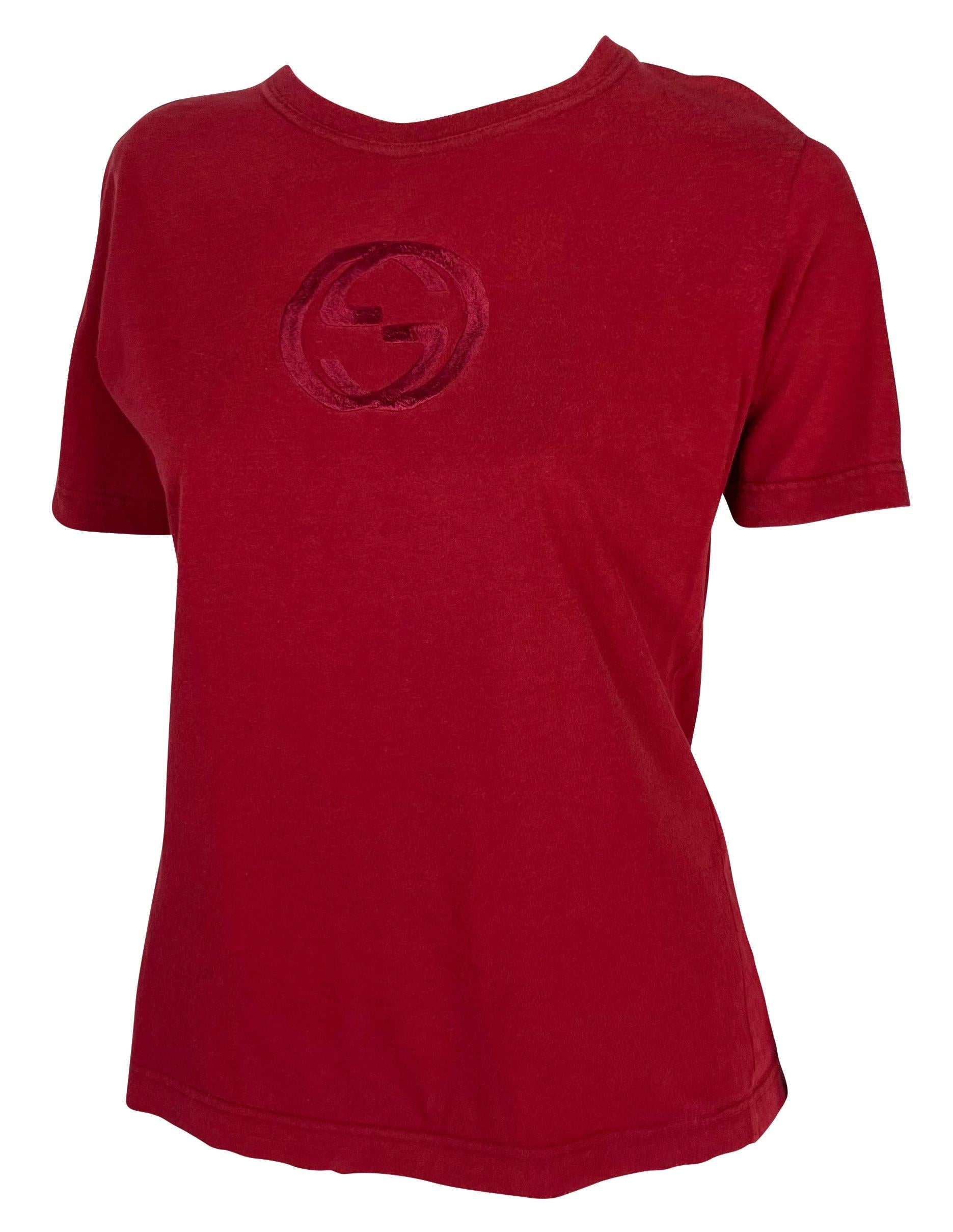 Presenting a red branded Gucci t-shirt, designed by Tom Ford. From the Spring/Summer 1997 collection, this classic crewneck t-shirt is perfectly elevated with a large embossed Gucci 'GG' logo at the chest. This unisex t-shirt has the perfect Gucci