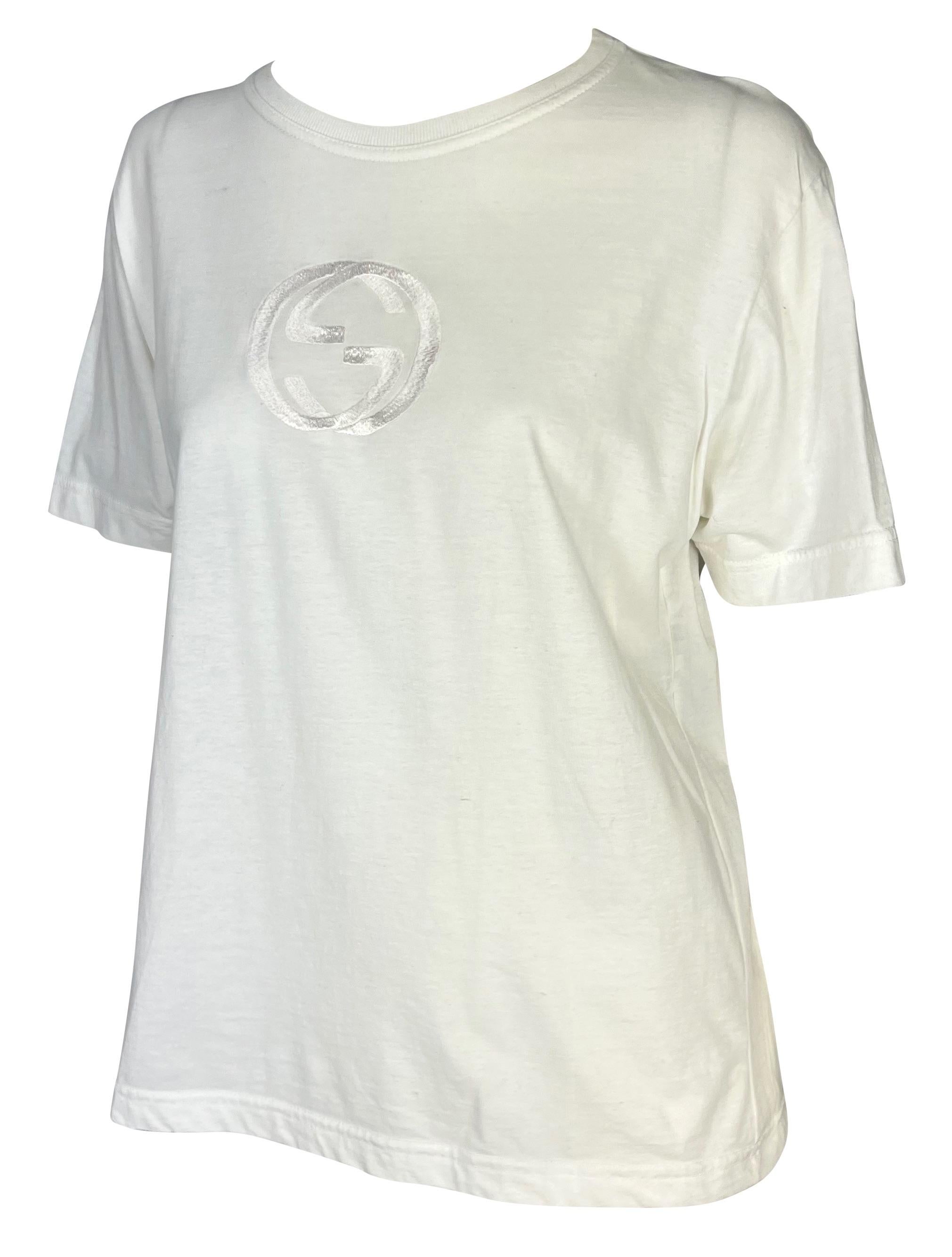 Presenting a vintage white Gucci t-shirt, designed by Tom Ford. From the Spring/Summer 1997 collection, this classic black t-shirt is elevated with a large embroidered interlocking 'GG' Gucci logo at the front. A unisex piece, this is a must have