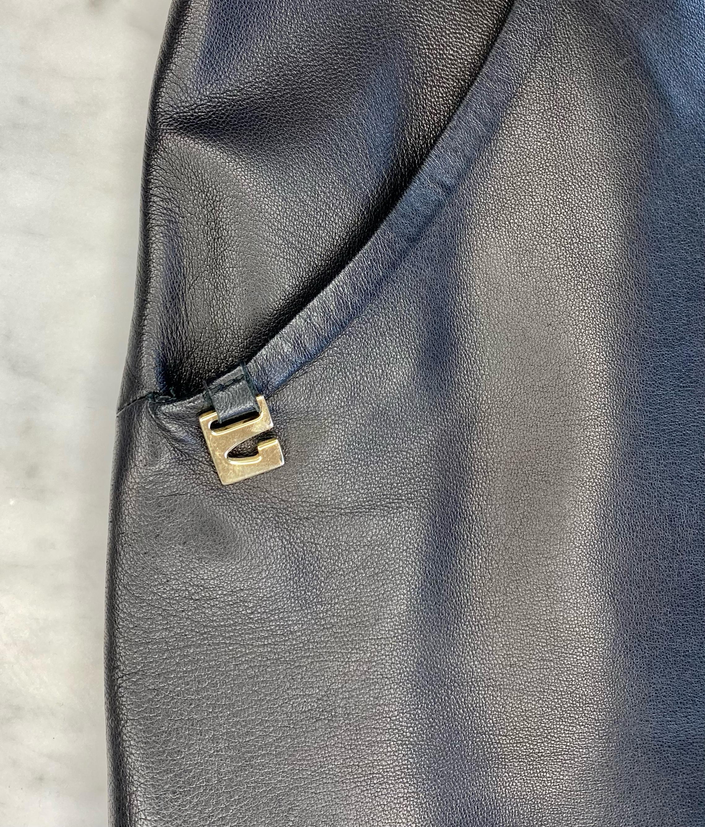 Presenting a rare leather tank top by Tom Ford for Gucci. This piece and features the classic Tom Ford 'G' medallion that was heavily featured in the S/S 1997 collection as well as two pockets at the waist. The leather was expertly cut to give a