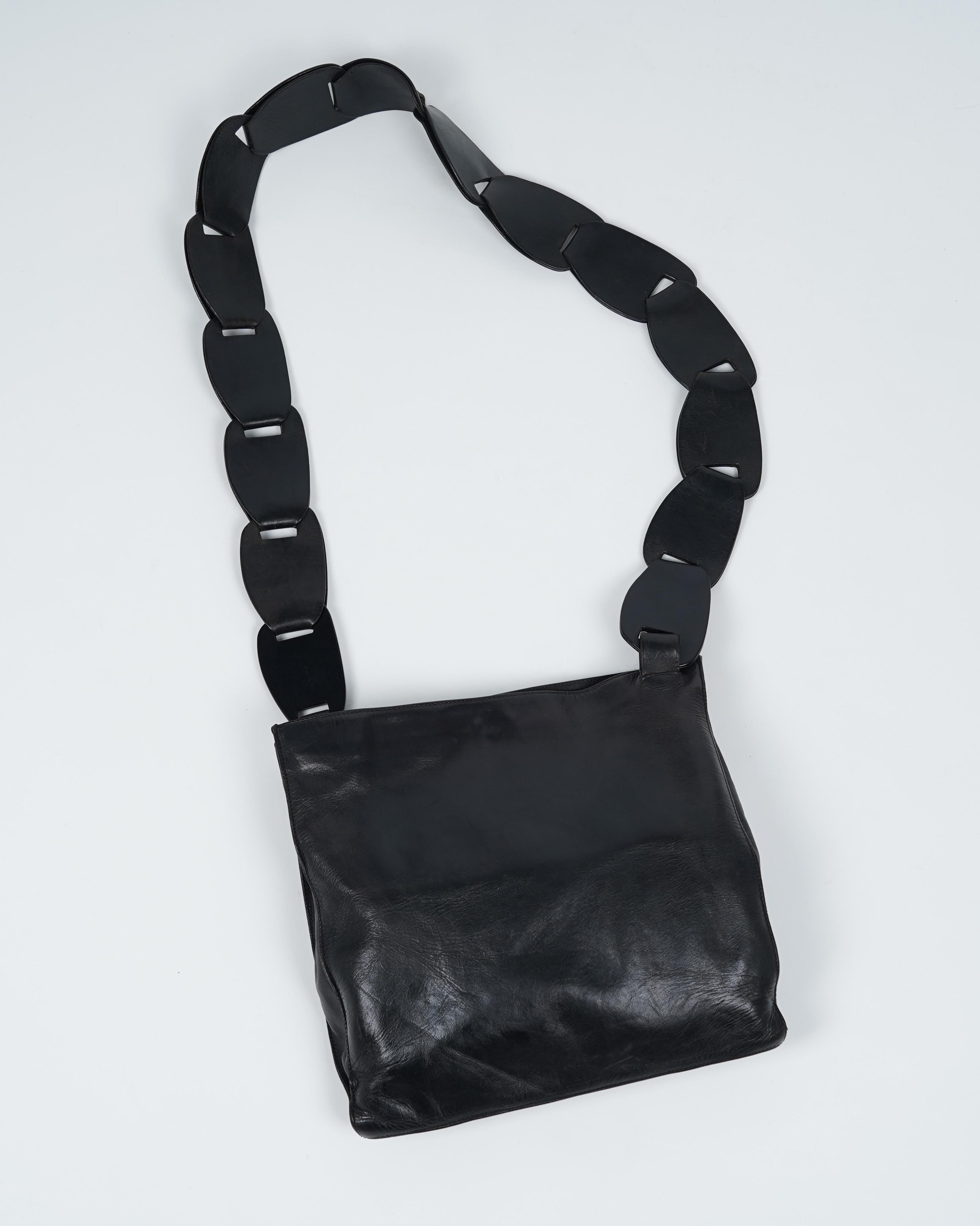 Presenting a beautiful black Gucci bucket bag, designed by Tom Ford. Two years into Tom Ford's tenure at Gucci, the Spring / Summer 1997 collection solidified him as the king of sexy in the industry. Tom Ford was one who did subversion and