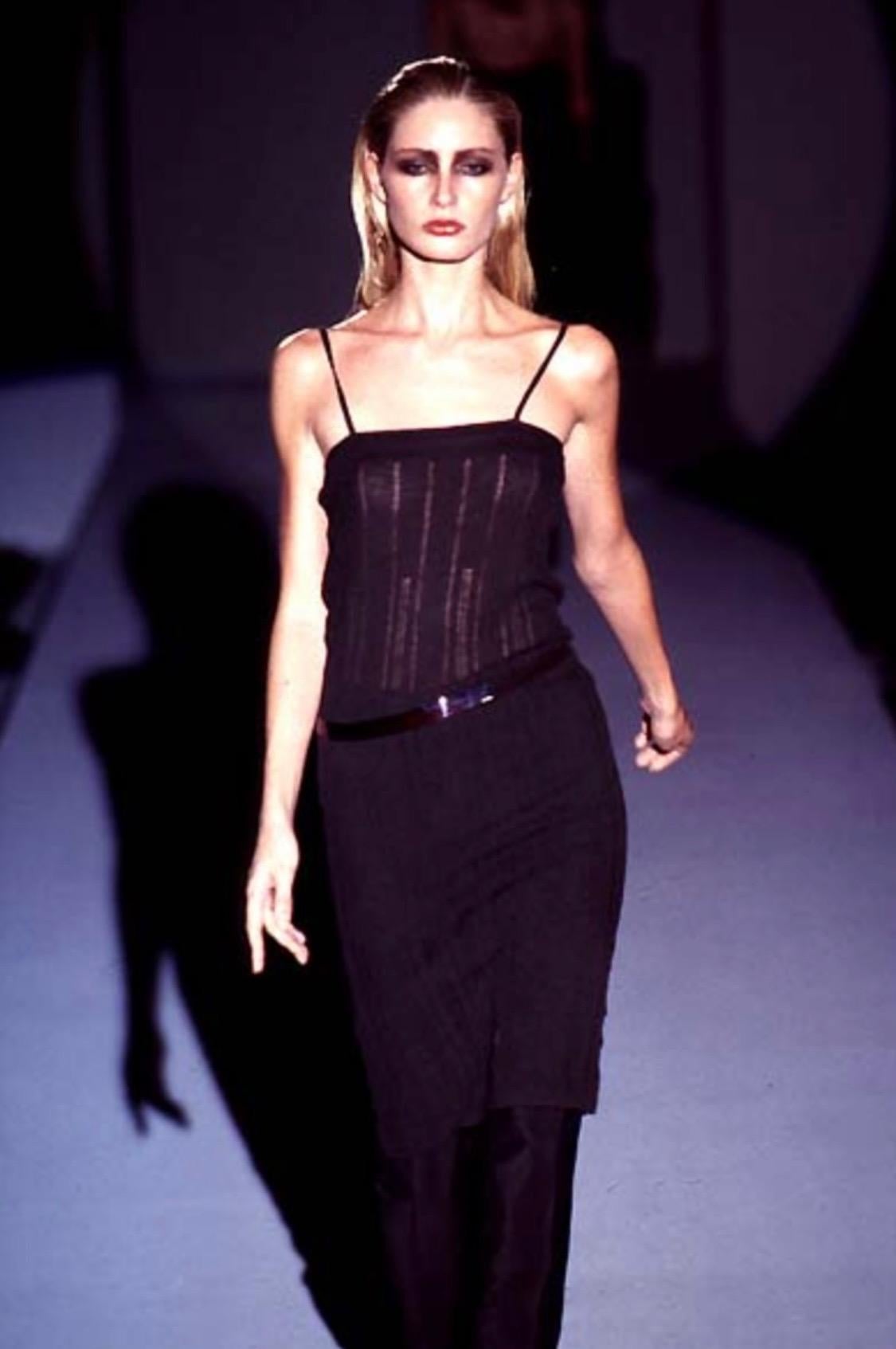 TheRealList presents: a sheer sleeveless dress designed by Tom Ford for Gucci's Spring/Summer 1997 collection. The knit wool blend stretches to hug the body in all of the right places. This Tom Ford classic debuted on the season's runway, but