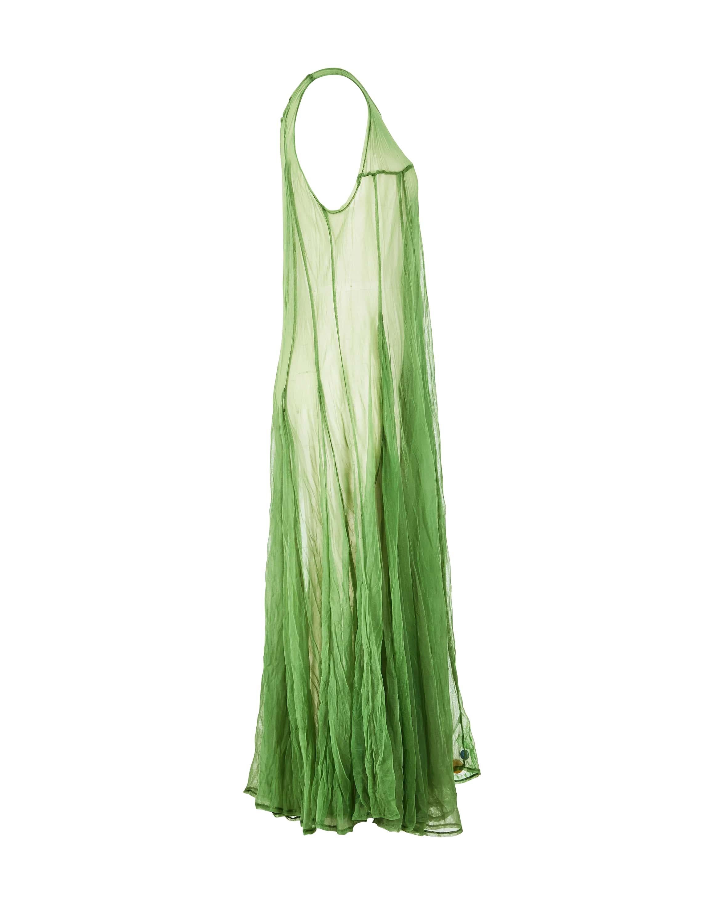 S/S 1997 Yohji Yamamoto moss green sheer mesh maxi dress. A-line full mesh dress with scoop neck, full skirt, and asymmetrical paneling throughout. Colorful geometric print detail at hem. Similar featured on runway. 

