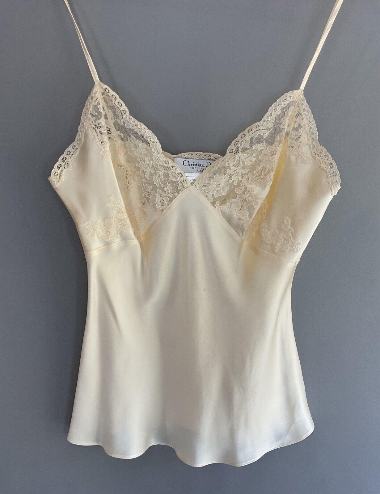 S/S 1998 Christian Dior by John Galliano Cream Silk Lace Trim Camisole Blouse

A delicate cream silk camisole from Christian Dior’s Spring/Summer 1998 collection, designed by John Galliano. Featuring exquisite lace trim, this piece embodies