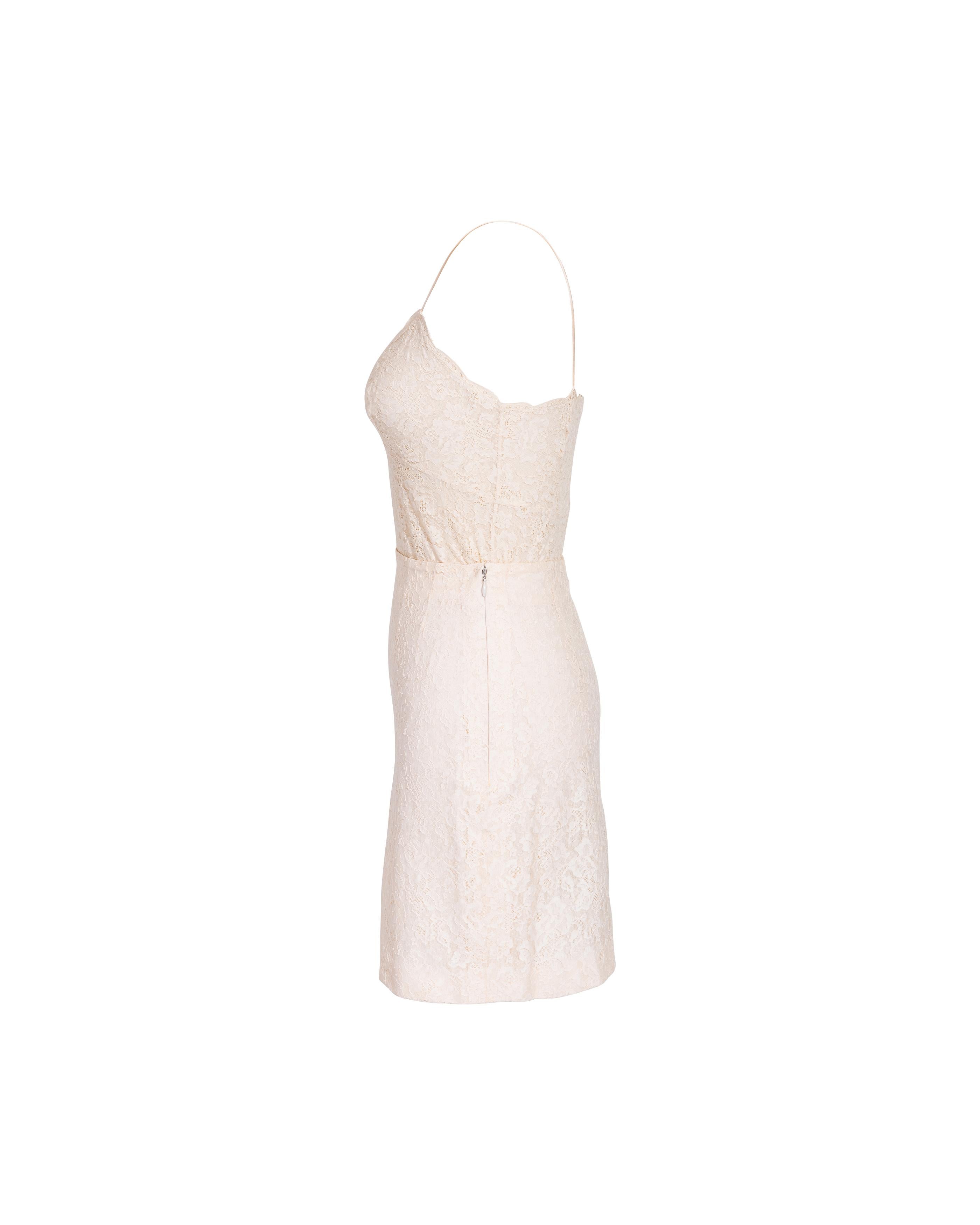 S/S 1998 Christian Dior by John Galliano cream lace mini skirt set. Spaghetti strap fully lace tank top with double bow details at chest pairs perfectly with lace mini skirt with thigh slit. Note that straps of top have additional fabric allotment